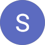 A blue circle with a large white letter S in the center, resembling a simple logo or icon design.