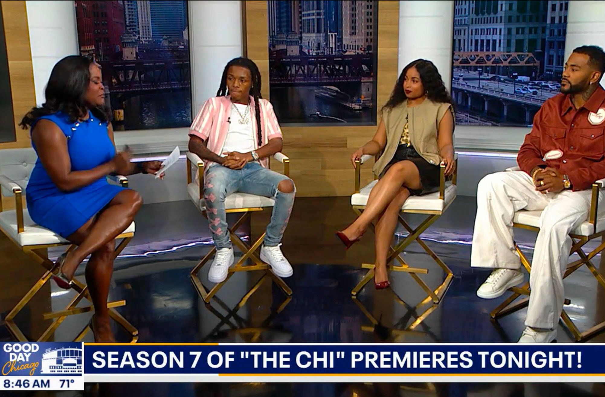 TV show hosts and guests discuss Season 7 of The Chi on a morning show set. They sit in chairs with a cityscape backdrop.