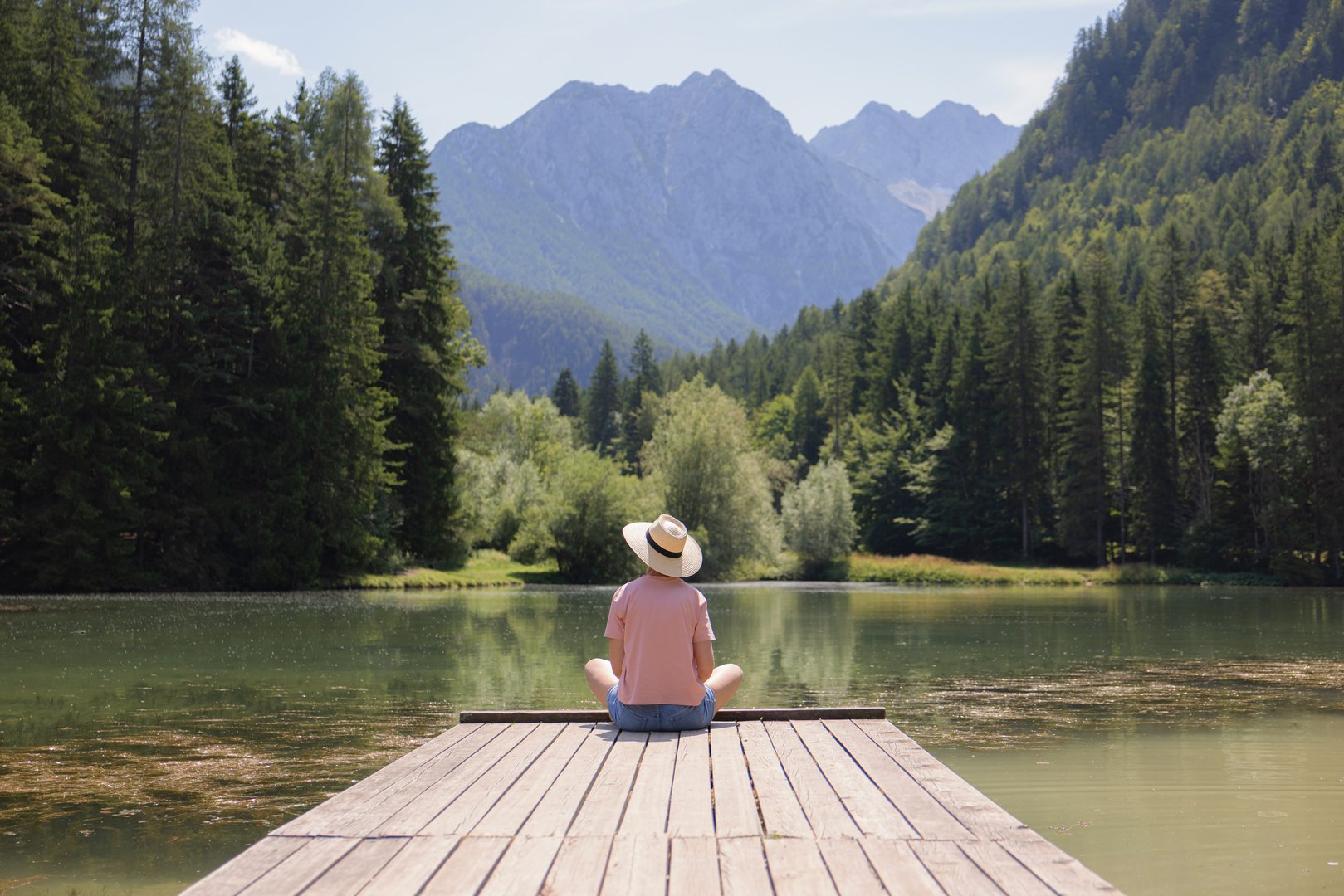 Person on dock by lake