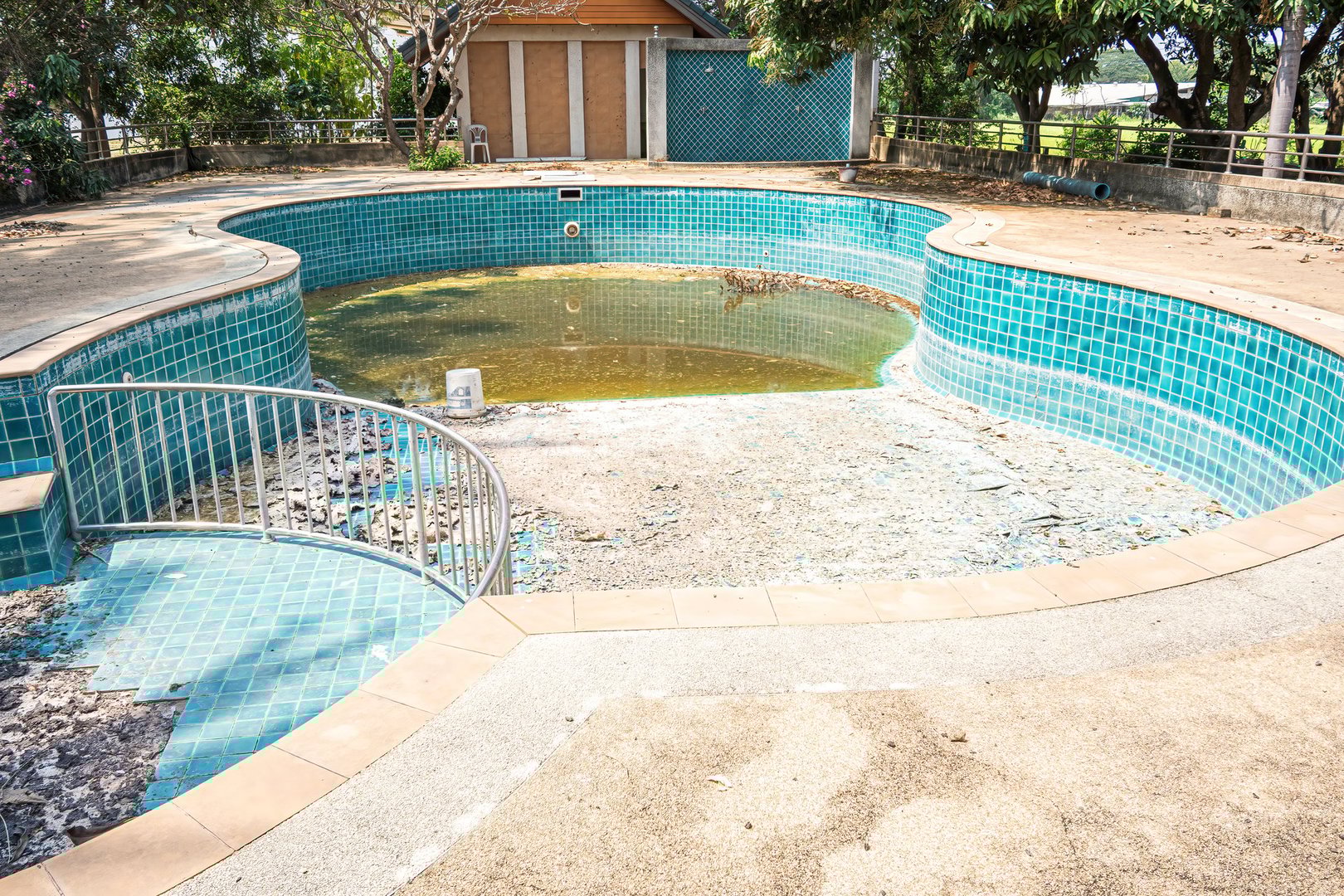 Abandoned swimming pool in the garden house.