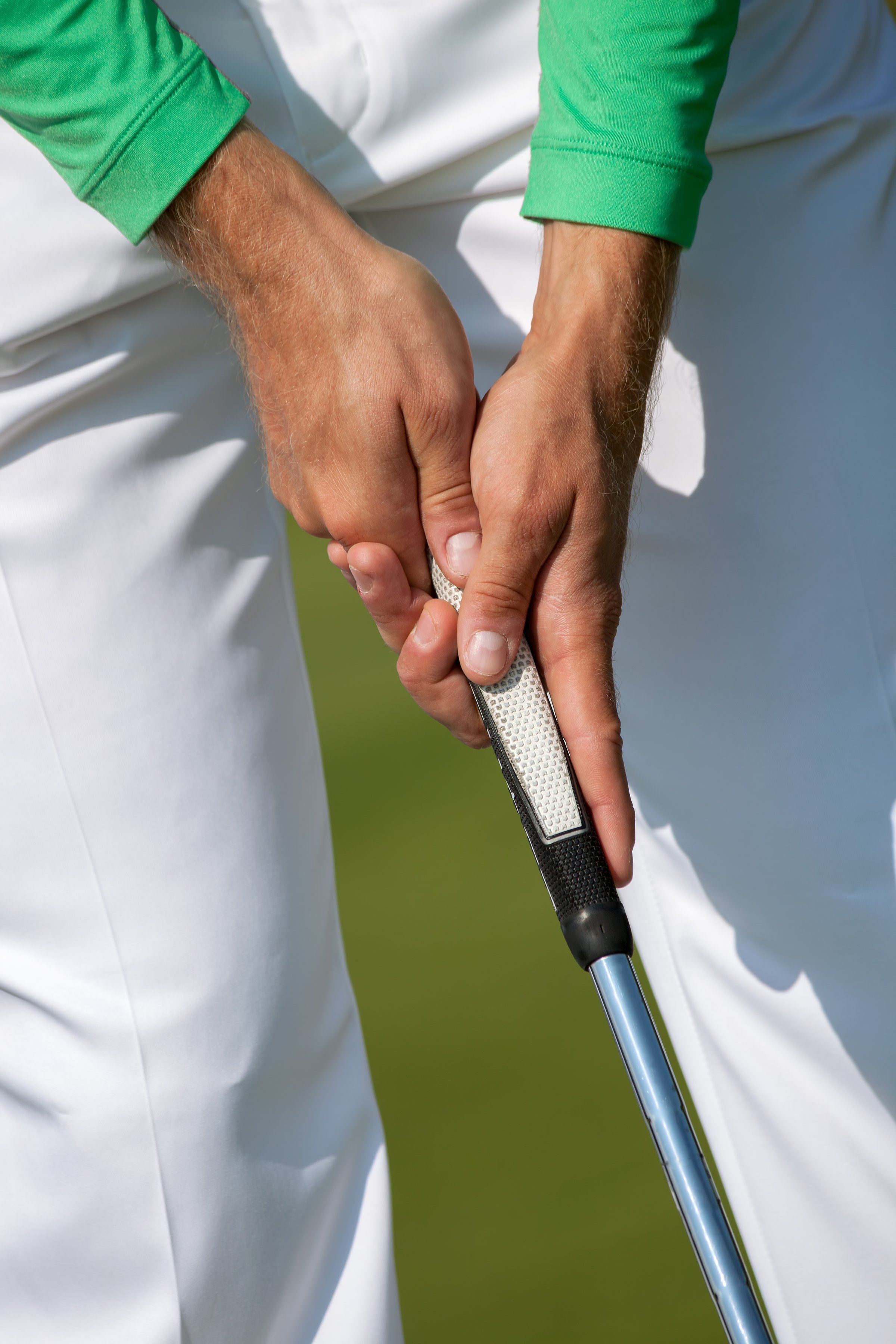 Man playing golf during a sunny day