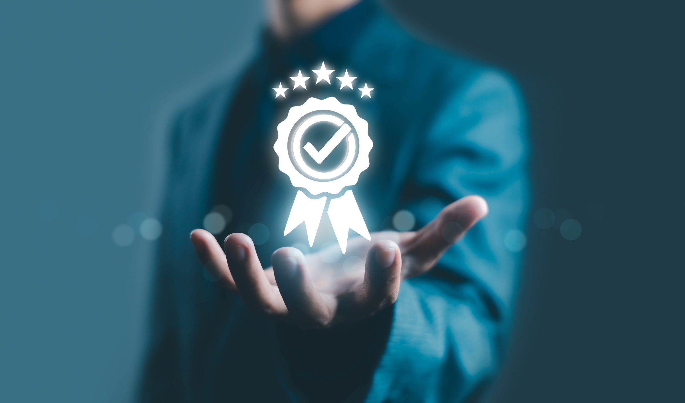 Businessman holding a glowing digital quality assurance badge with stars and check mark icon, representing trust, certification, success, and premium service. Perfect for business, ISO, and branding.