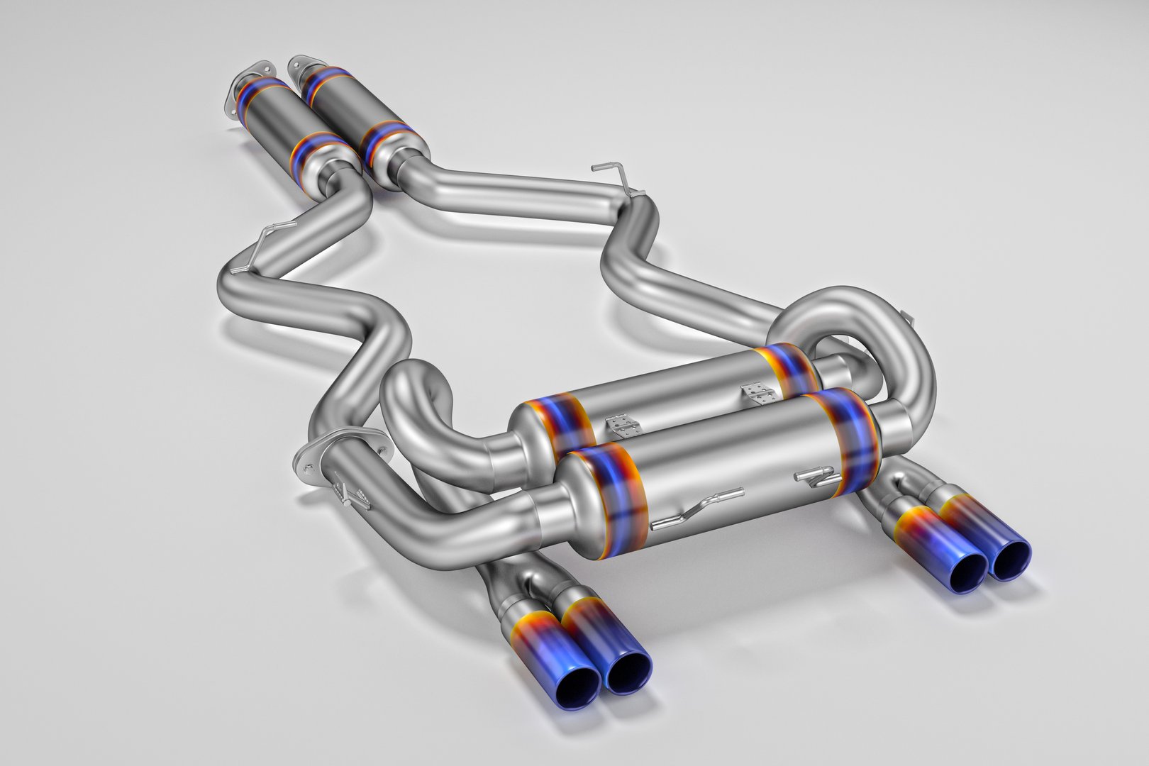 Tuning exhaust system for a sports car. Car muffler, exhaust silencer on a white background. 3D rendering