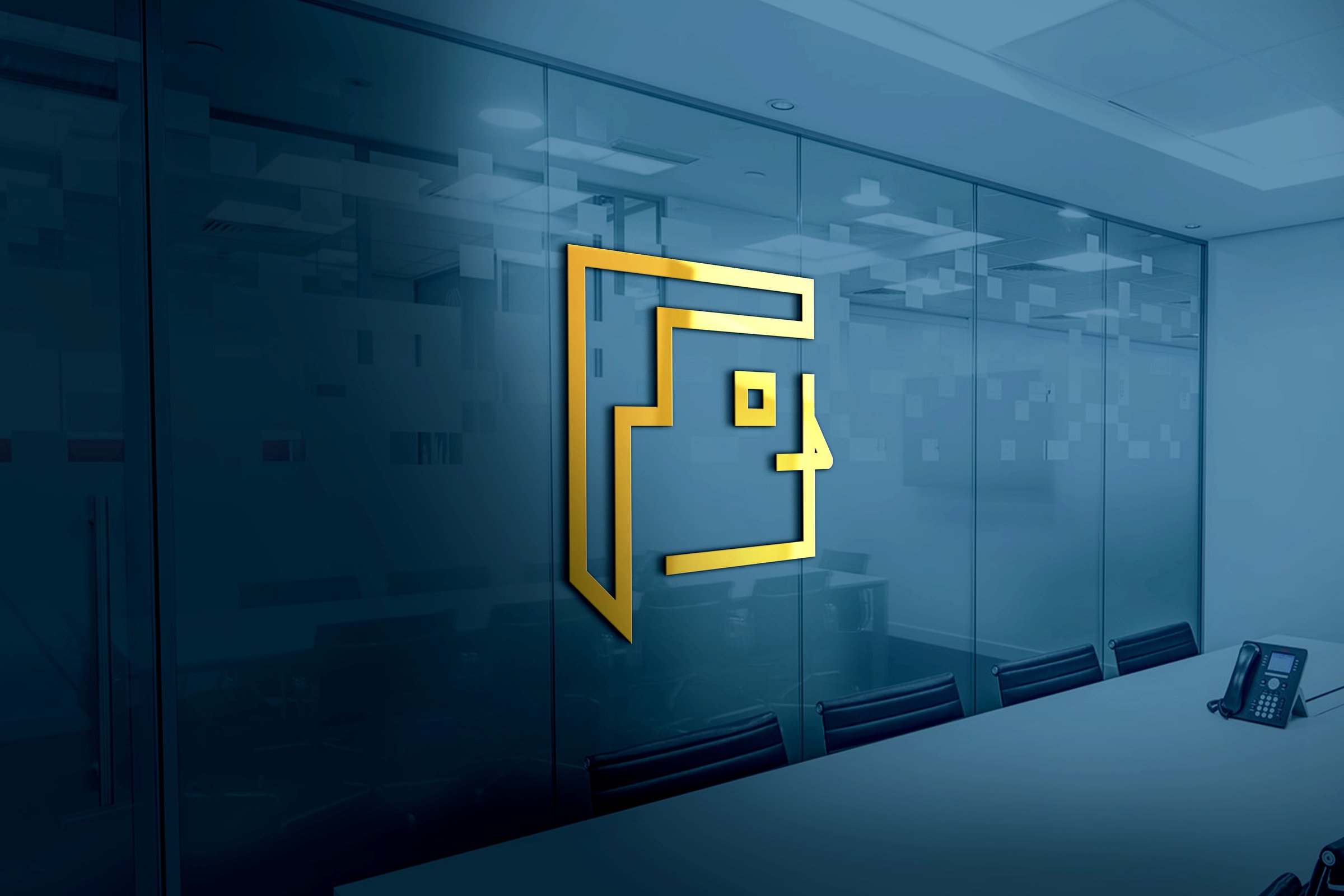 A 3D-rendered golden face logo design on a wall in a corporate office meeting room
