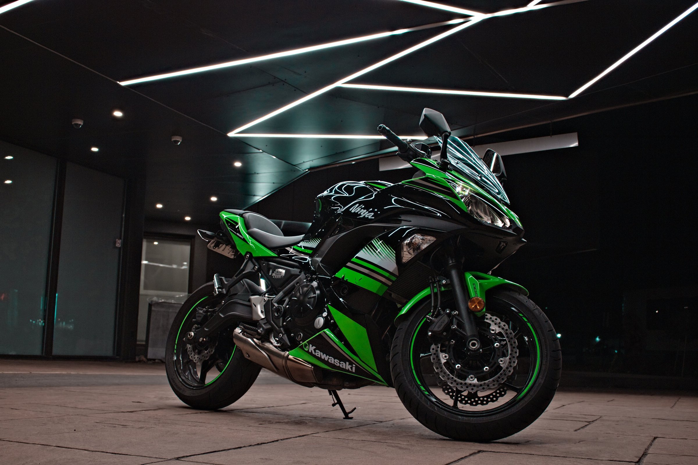 Toronto, Canada – July 28, 2020: A Kawasaki Ninja green and black motorcycle in a showroom