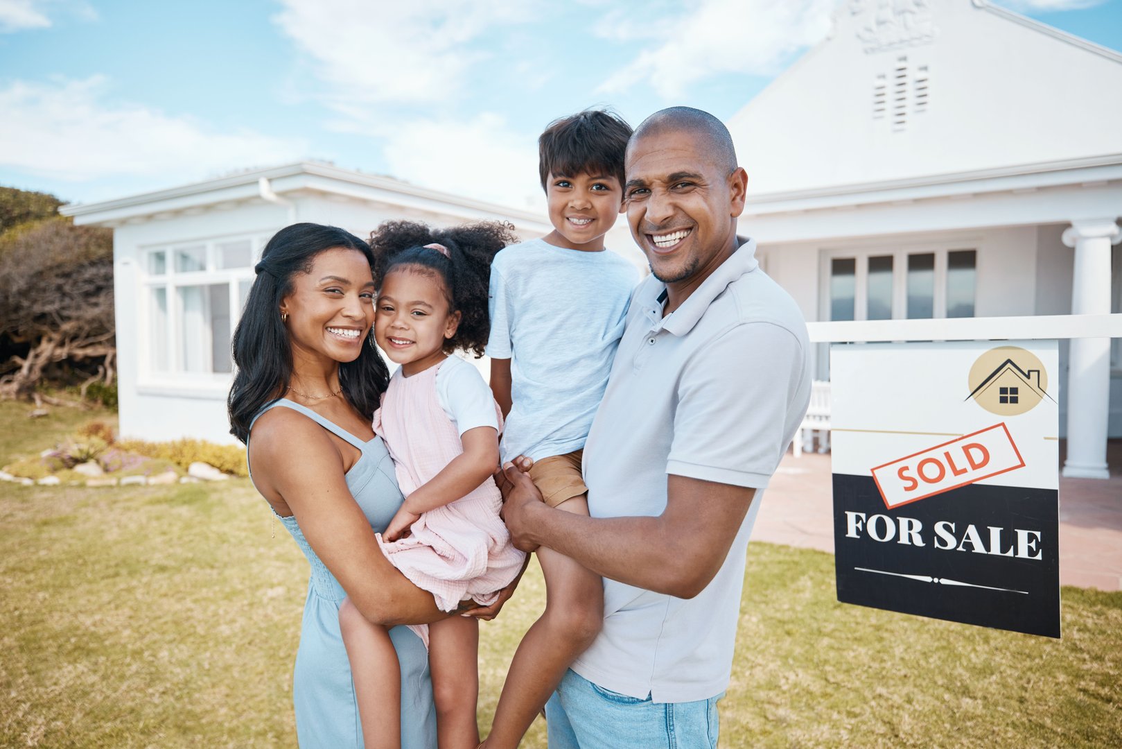 Family, portrait and smile at new home, outdoor and mortgage for property purchase, building investment and sign. Happy, real estate and mother, father and children with parents moving into house.