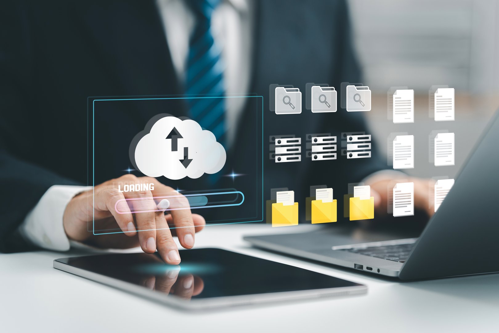 Cloud computing concept. Businessman uses a tablet and laptop with digital cloud storage and data icons, suggesting cloud-based data management. upload and download. digital service. data center.