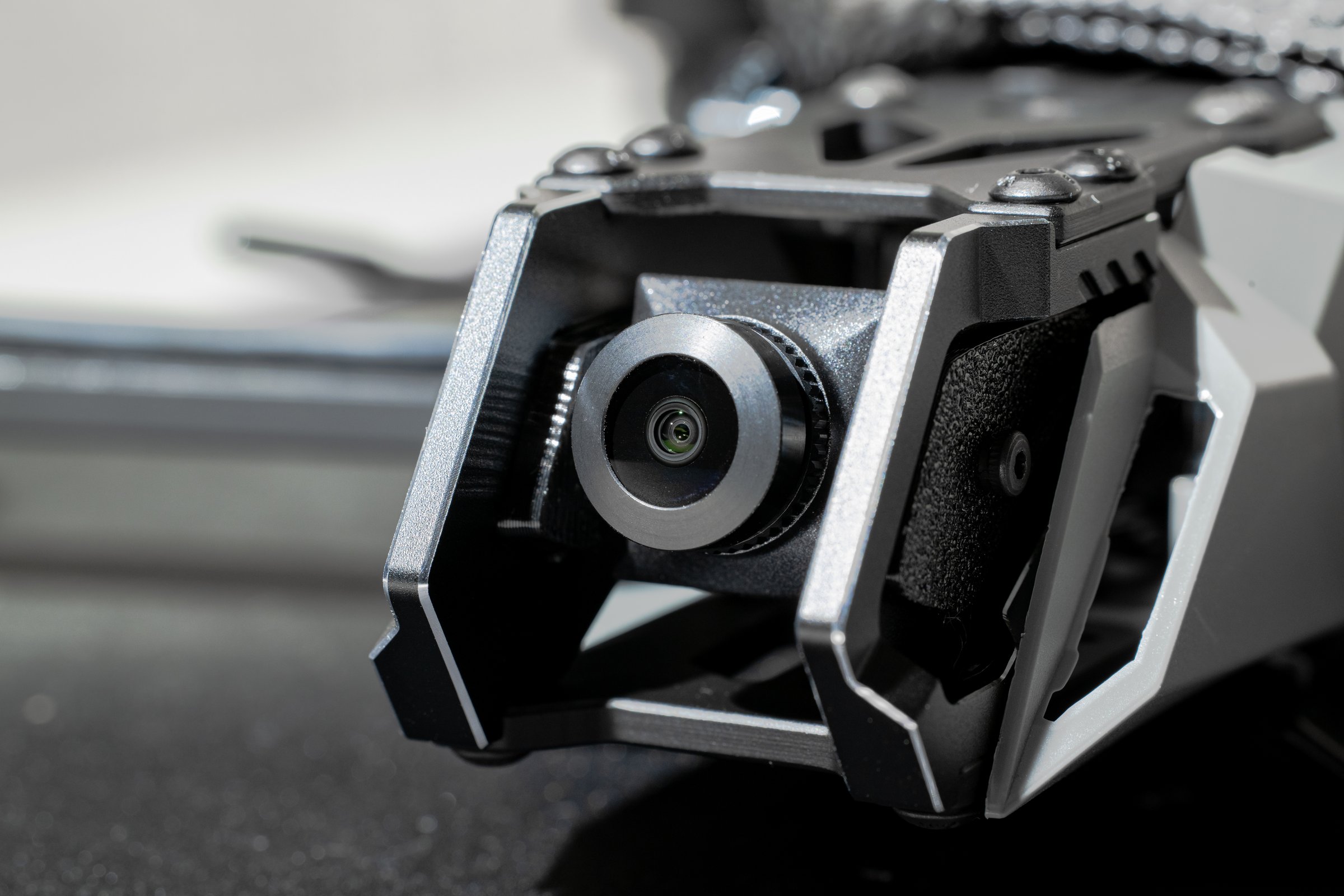 drone camera device technological systems of first person view concept and gimbal equipment close up metallic and plastic details workshop place