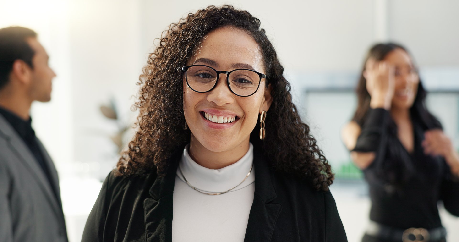Face, business and woman with glasses, professional and lawyer in a meeting, corporate and employee. Portrait, person and worker in a workplace, smile and advocate with teamwork, law firm or ambition