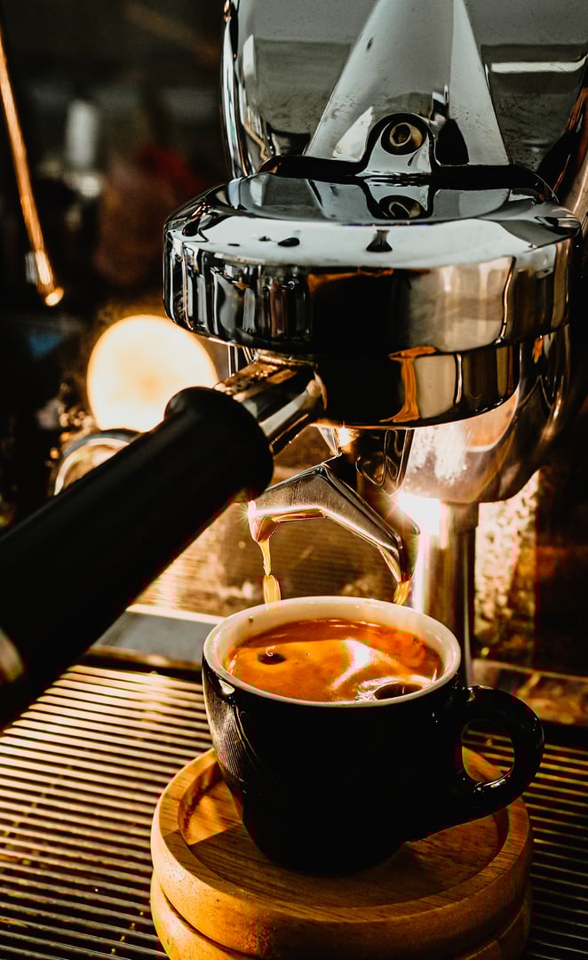 Espresso pouring from coffee machine at cafe,Brewing the espresso coffee from the machine