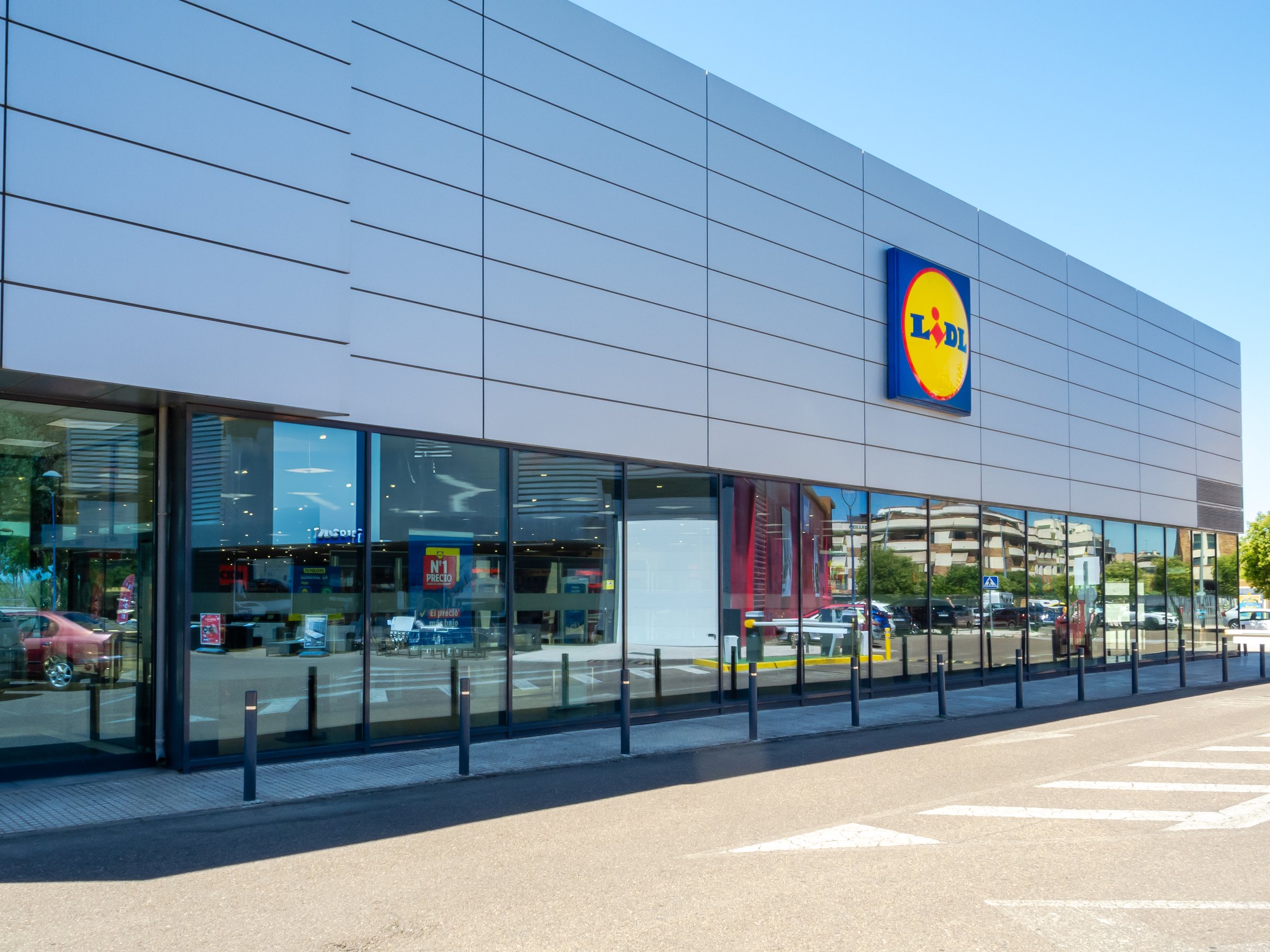 Badajoz, Spain. July 3, 2024. Modern facade with glass windows of a Lidl supermarket in the city of Badajoz.