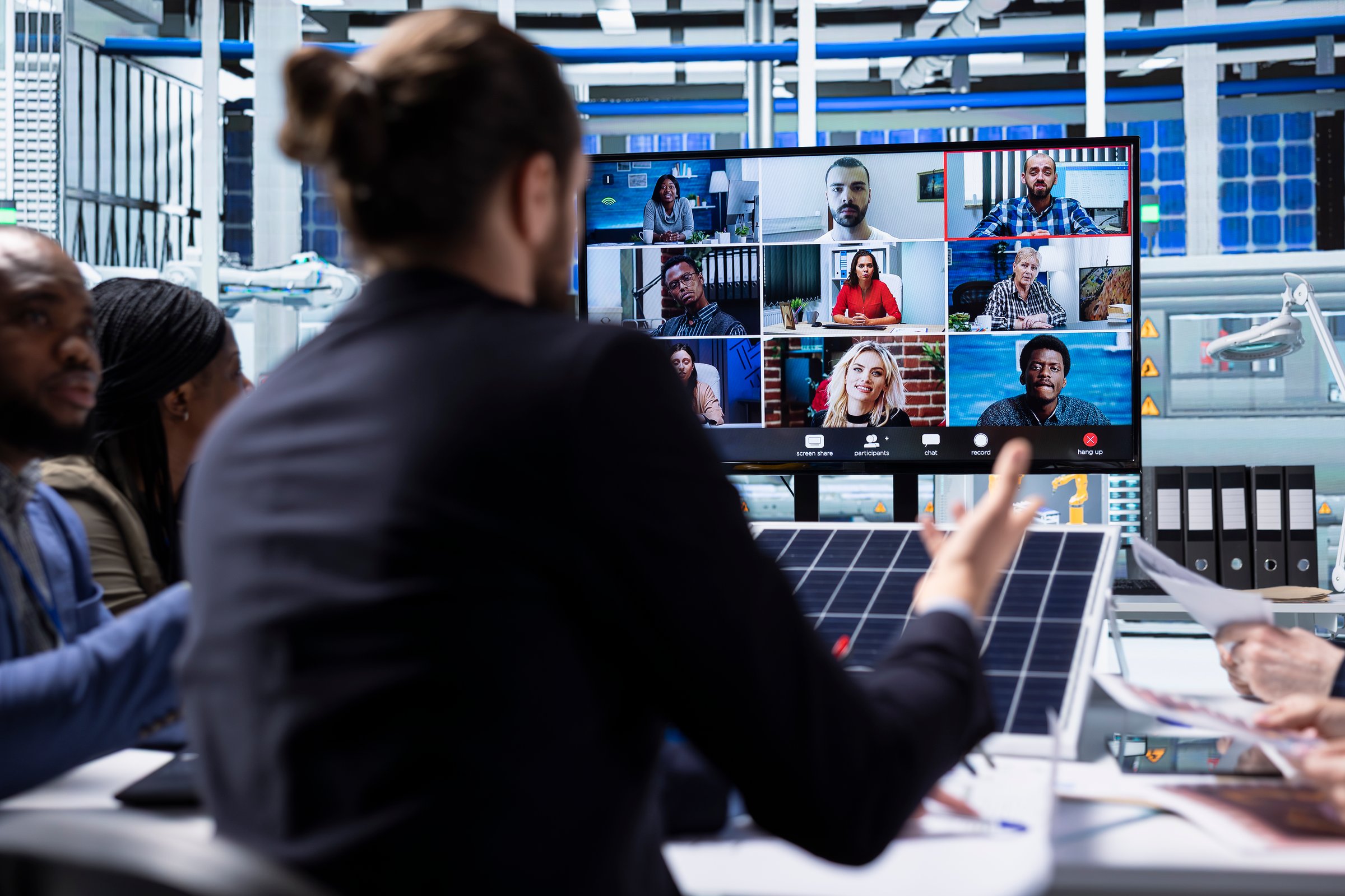 Photovoltaics factory management team doing videocall meeting to talk about manufacturing equipment. Businesspeople collaborate on green energy investments, chatting with investors in teleconference