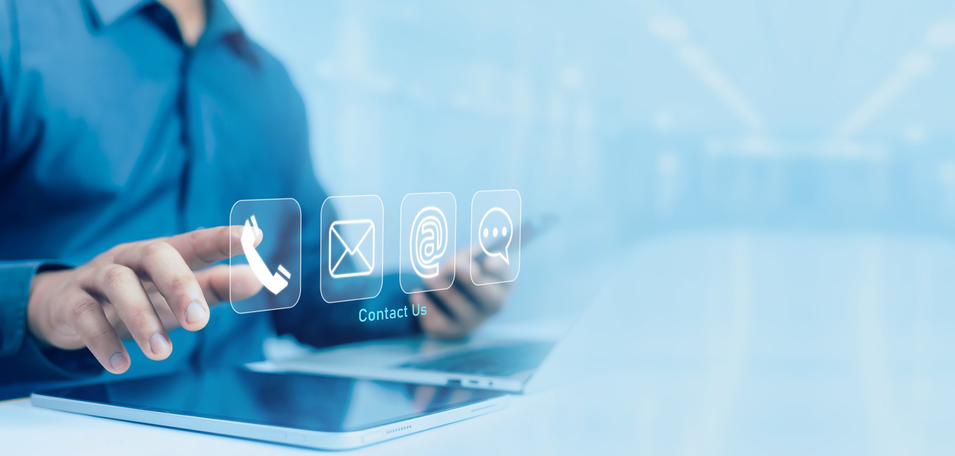 Businessman using laptop with contact us concept icons (address, phone, email, call) to contact customer support, email, website help, business contact service, digital technology.