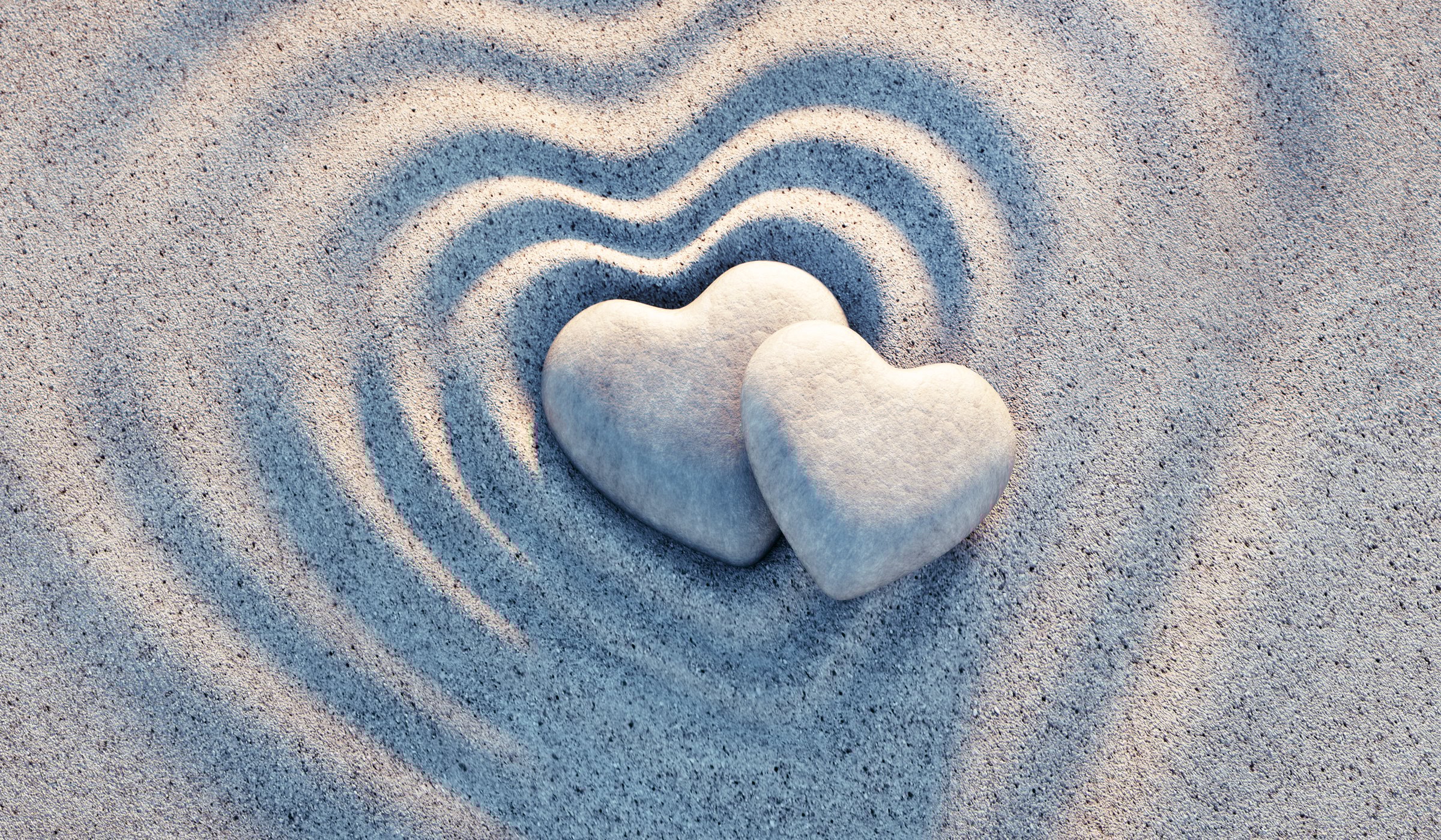 Two heart shaped pebbles on circle sand waves with evening sun - 3d illustration