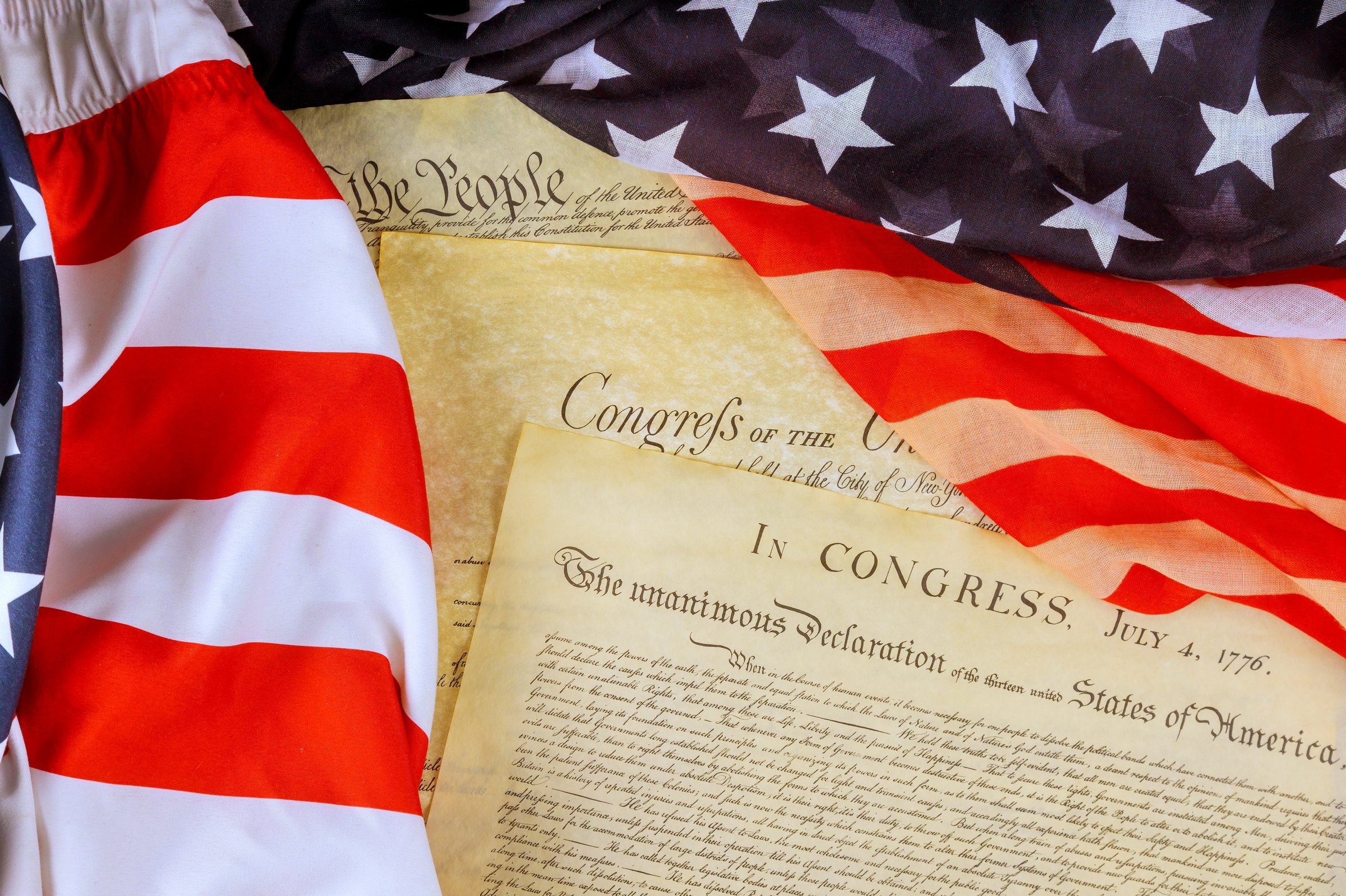 American flag Declaration of Independence represent national pride during historical event in July.