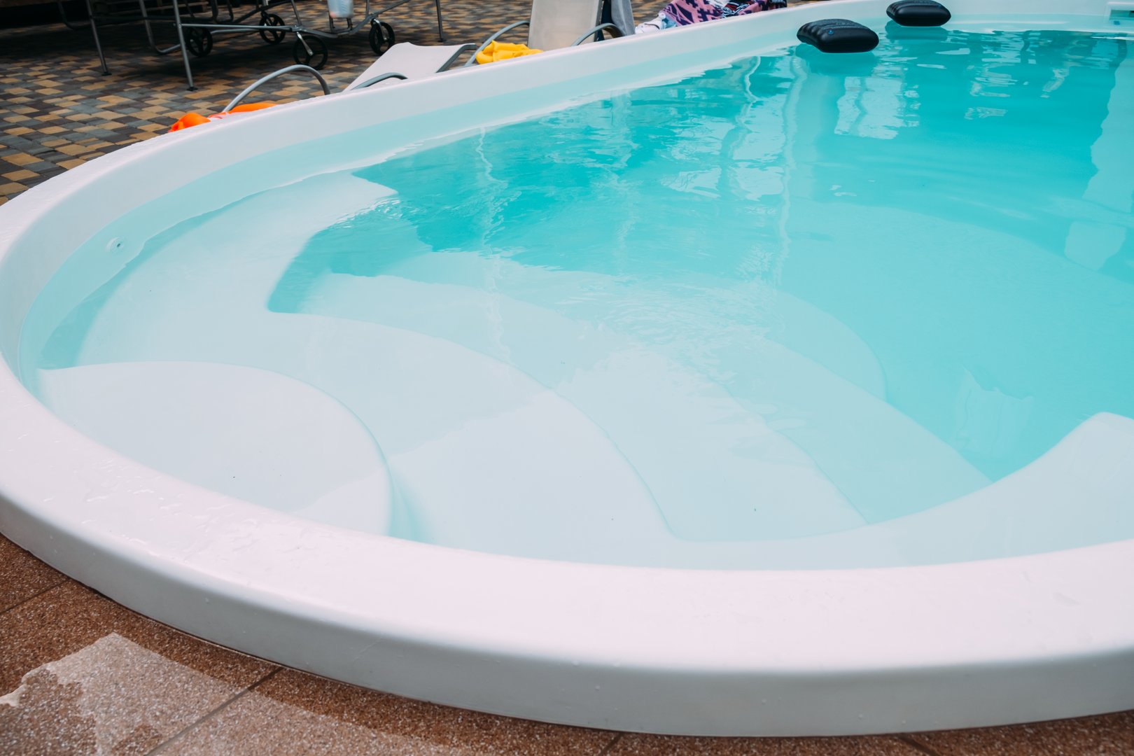 Fiberglass pool in the hotel courtyard. The pool is filled with clean clear water