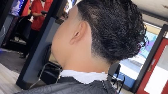 Modern barbershop interior with professional styling station