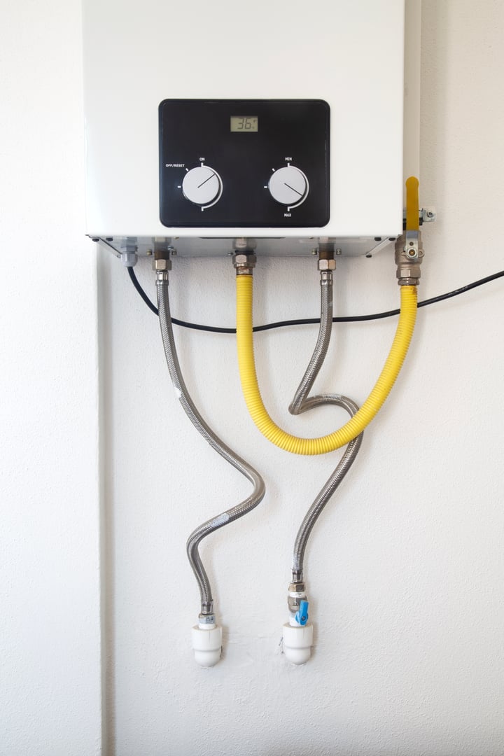 Modern Electric Water Heater on the Concrete Wall