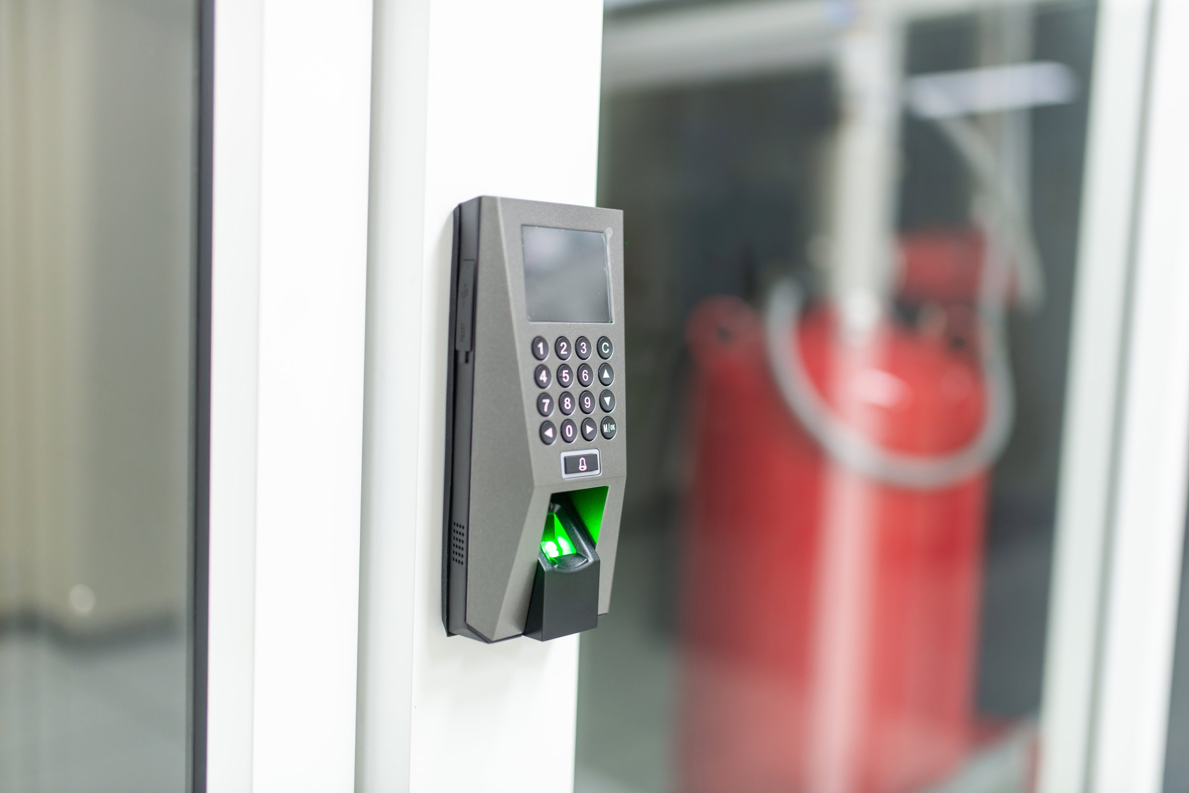 Modern security access control system featuring a keypad and fingerprint scanner, designed for enhanced safety and authentication in various facilities.