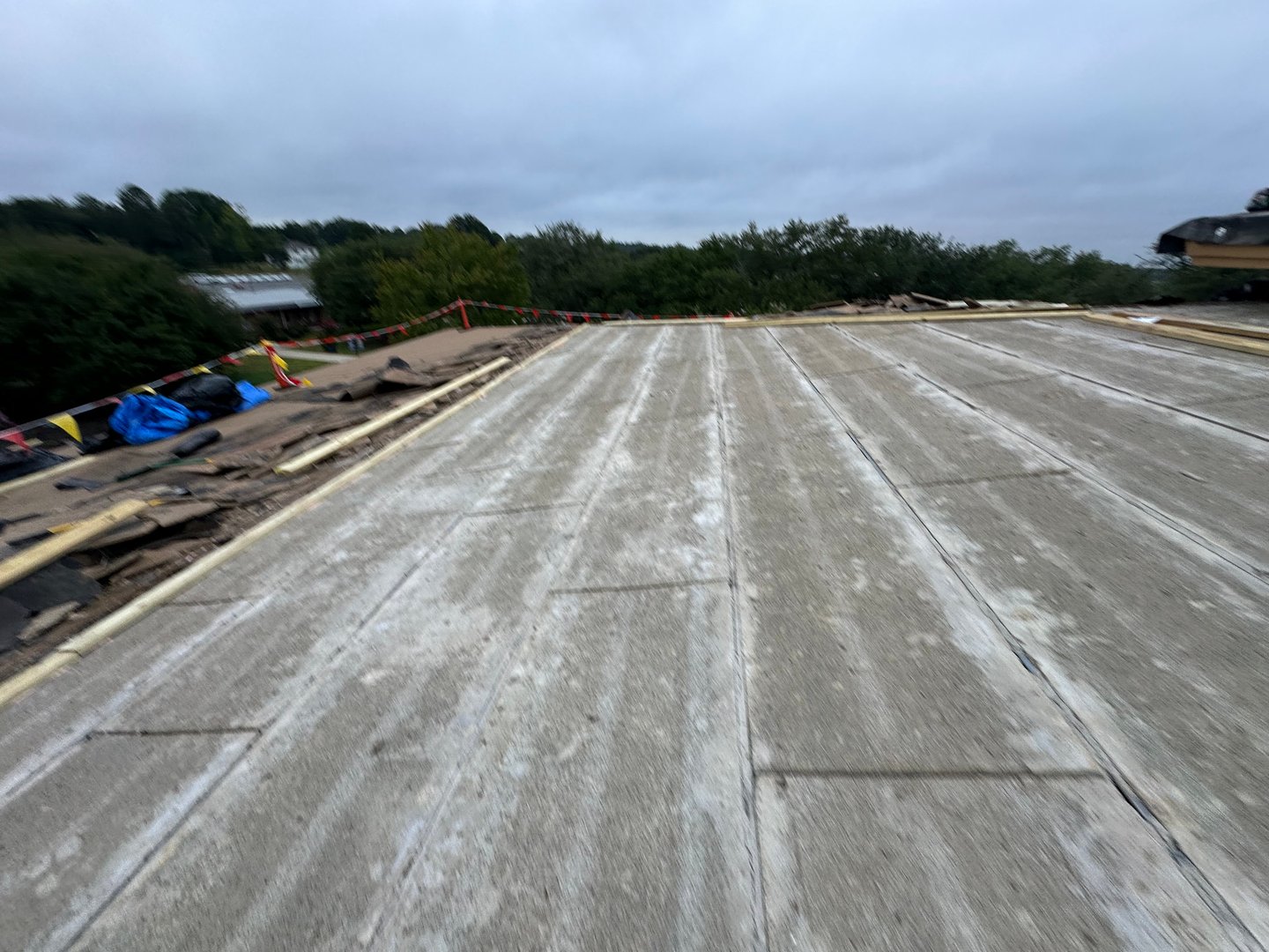 Roofing project with professional contractor equipment