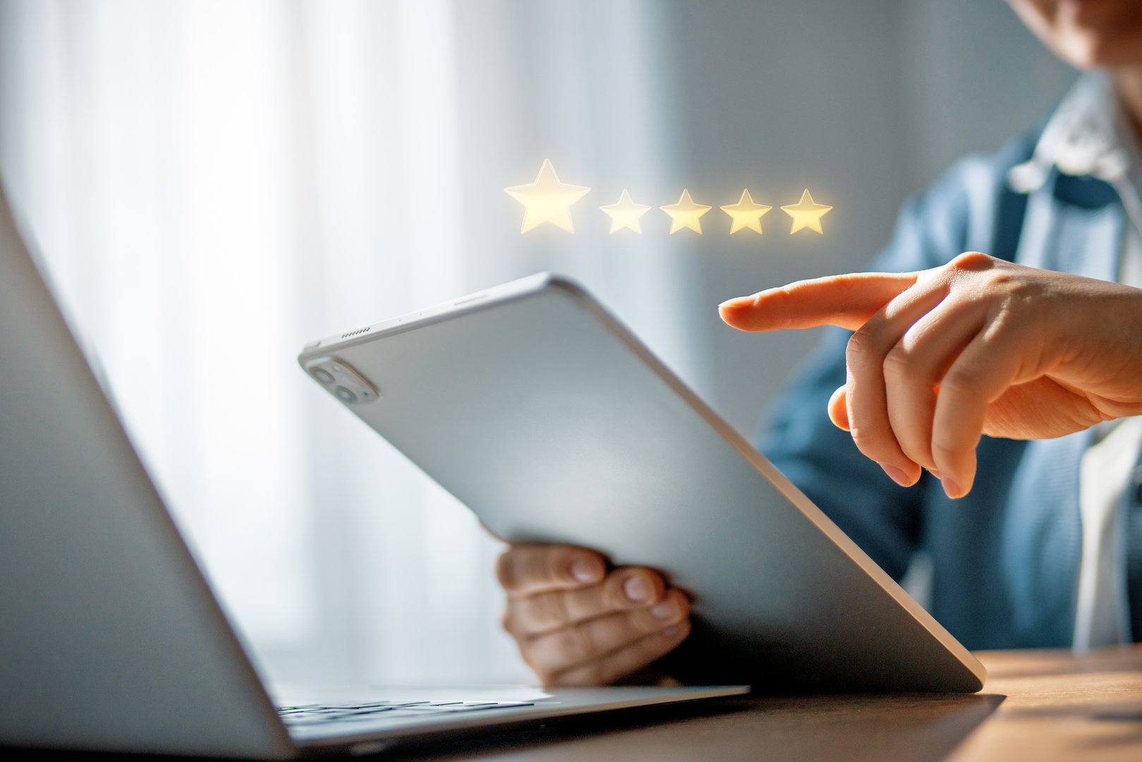 Person is holding a tablet to give a rating application