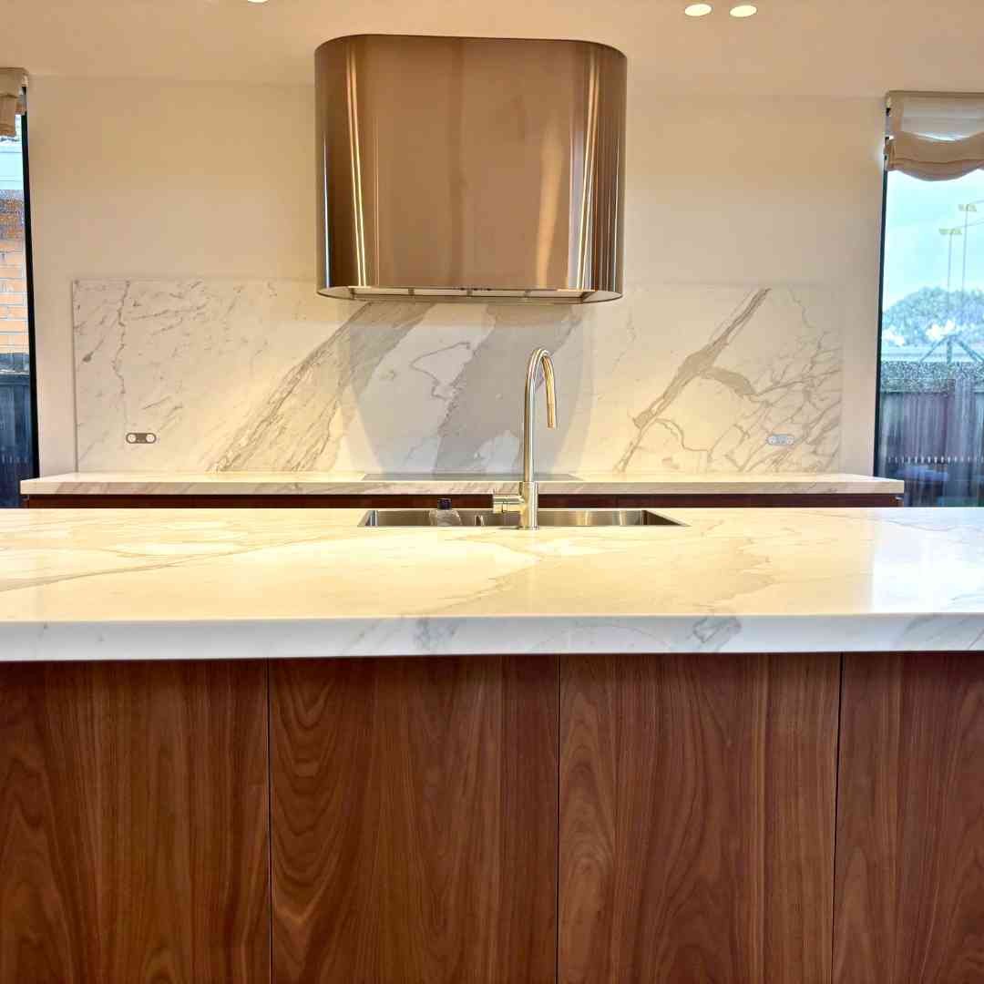 Kitchen splashback detail featuring natural stone tiles and premium finishes