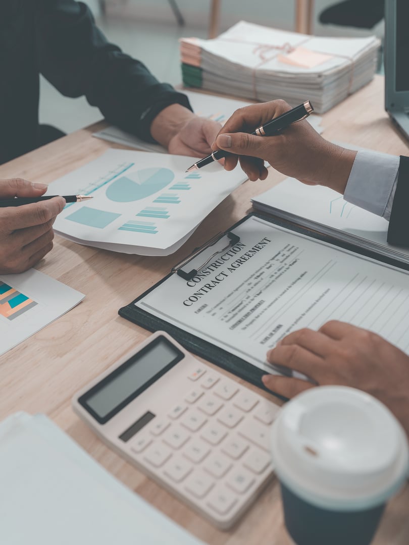 The meeting discussed charts and graphs showing the results of investments and business growth showing the results of investments, close-up.