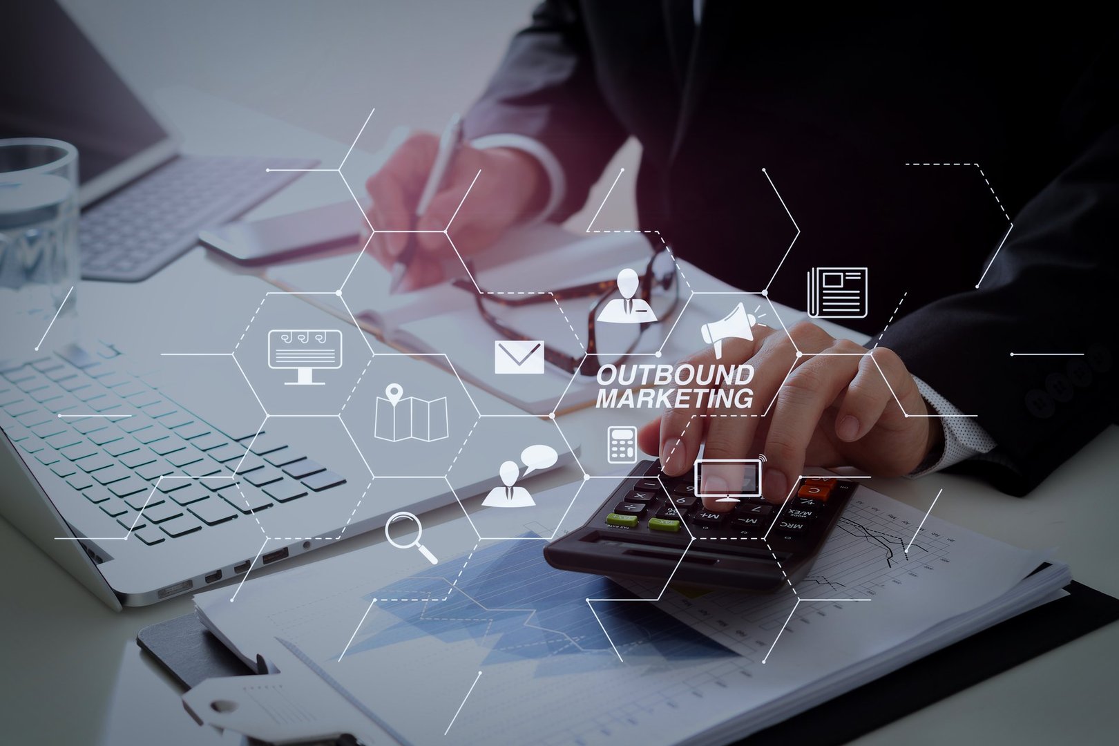 Outbound marketing business virtual dashboard with Offline or interruption marketing.businessman hand working with finances about cost and calculator and latop with mobile phone on withe desk.