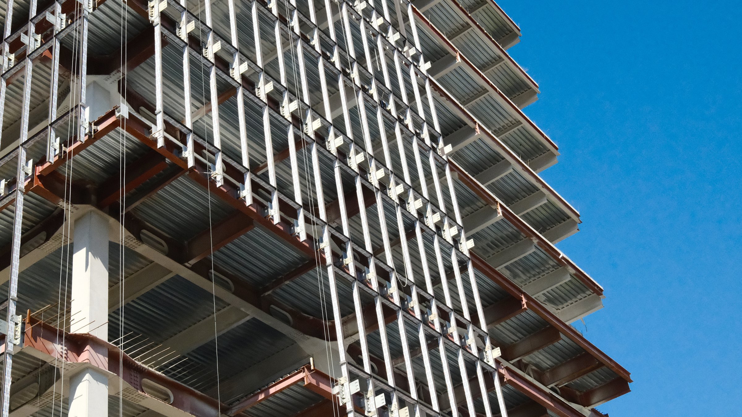 Construction site showing modern building framework with exposed steel beams