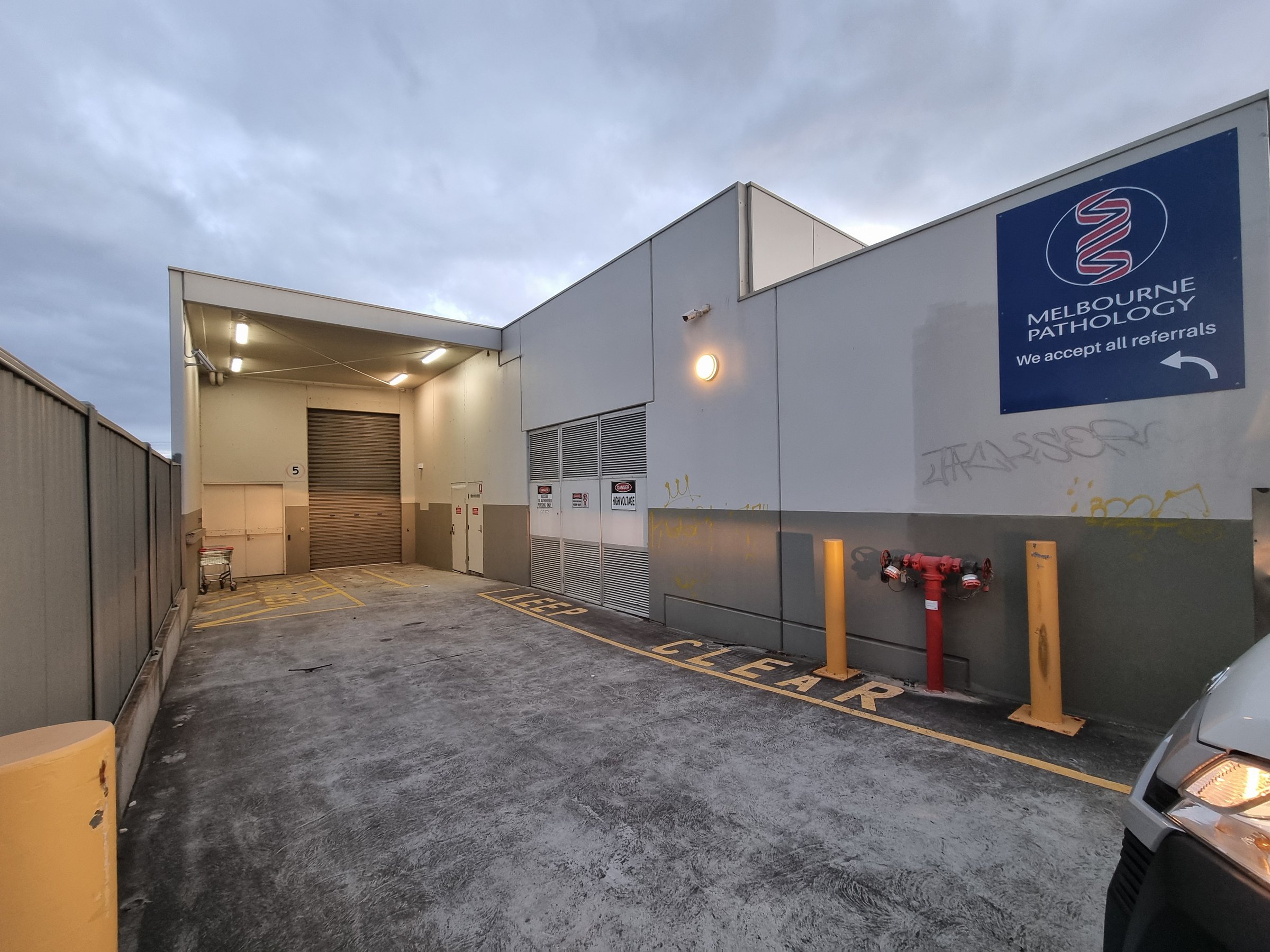 Quality Painting Group retail store makeover - June 2024 before photo showing weathered storefront condition needing refresh