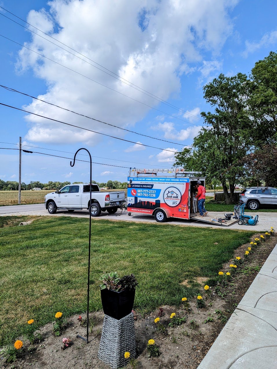 Kitchen remodel with white cabinets and island by Just Ask Home Improvement