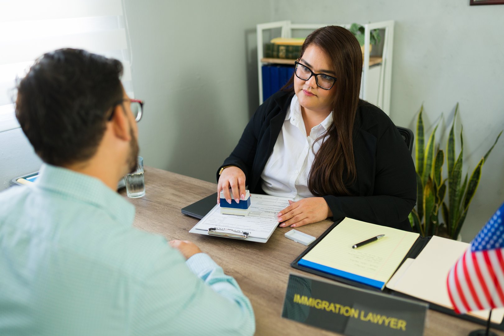 Female immigration lawyer providing legal advice