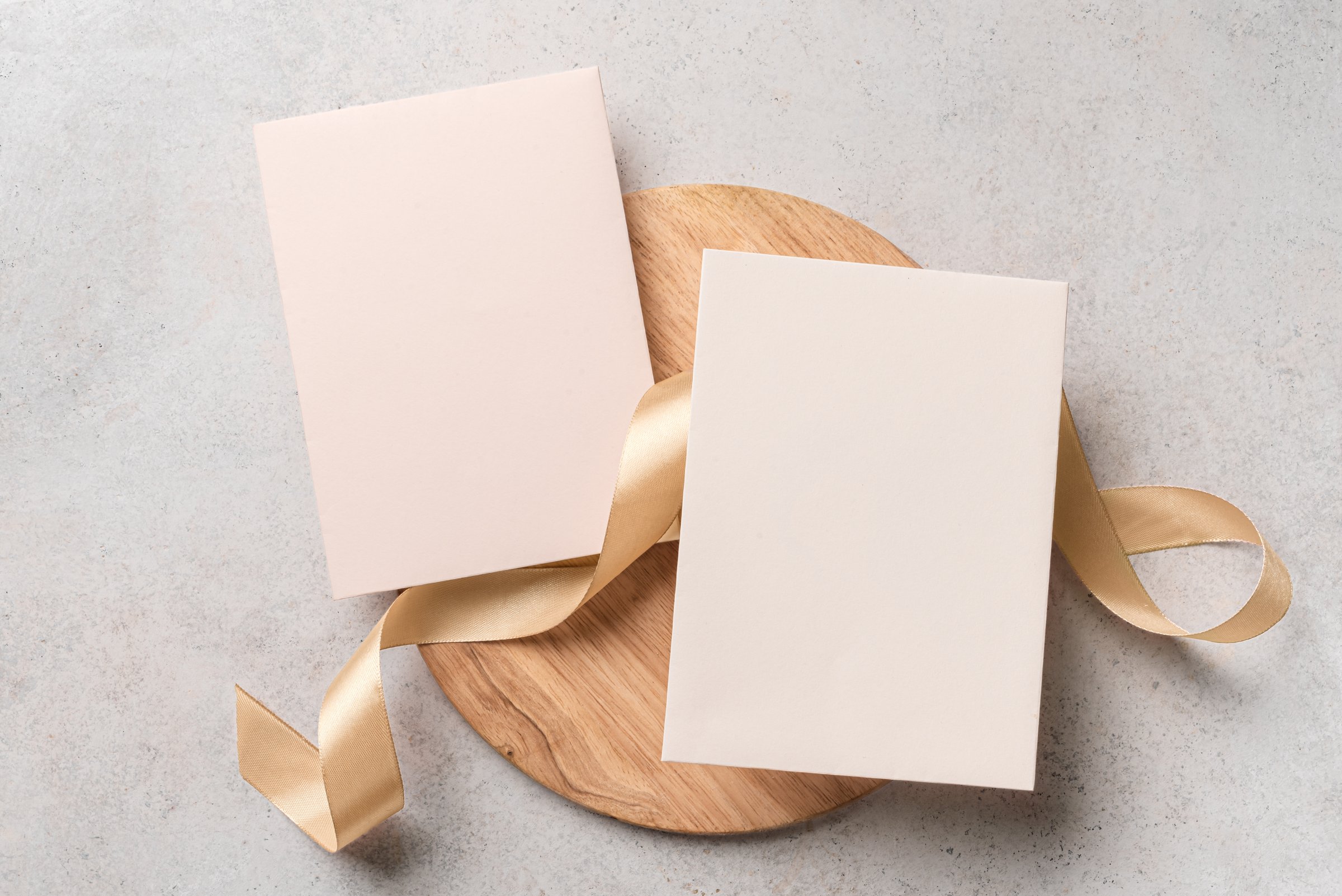 Two blank cards 5x7 mockup with silk ribbon, space for text, neutral design template. Beige pink wedding invitation card design.