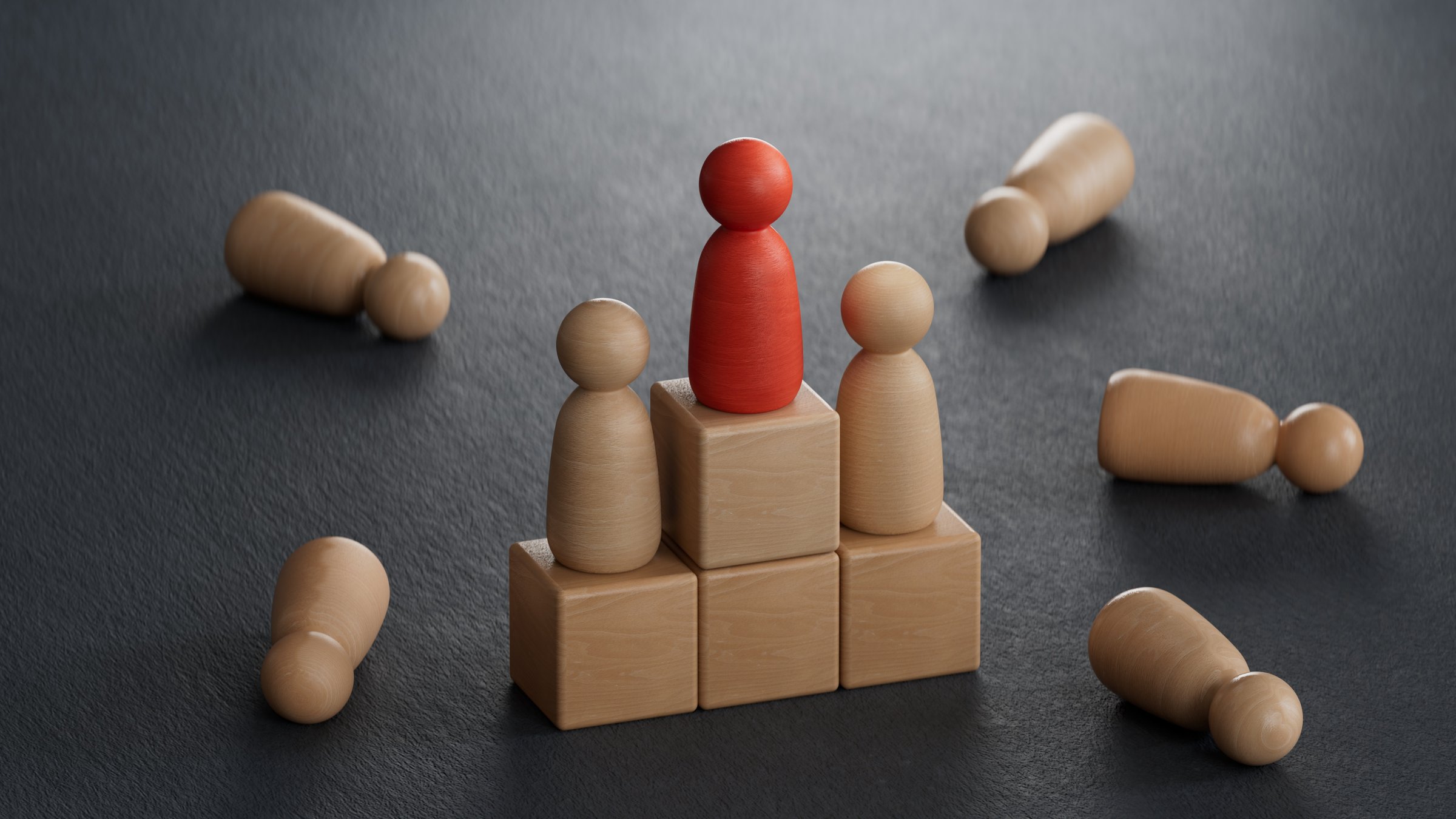 3D illustration of a podium with golden, silver ans bronze pawns . Concept of contest or competition winners.3D rendering on black background.