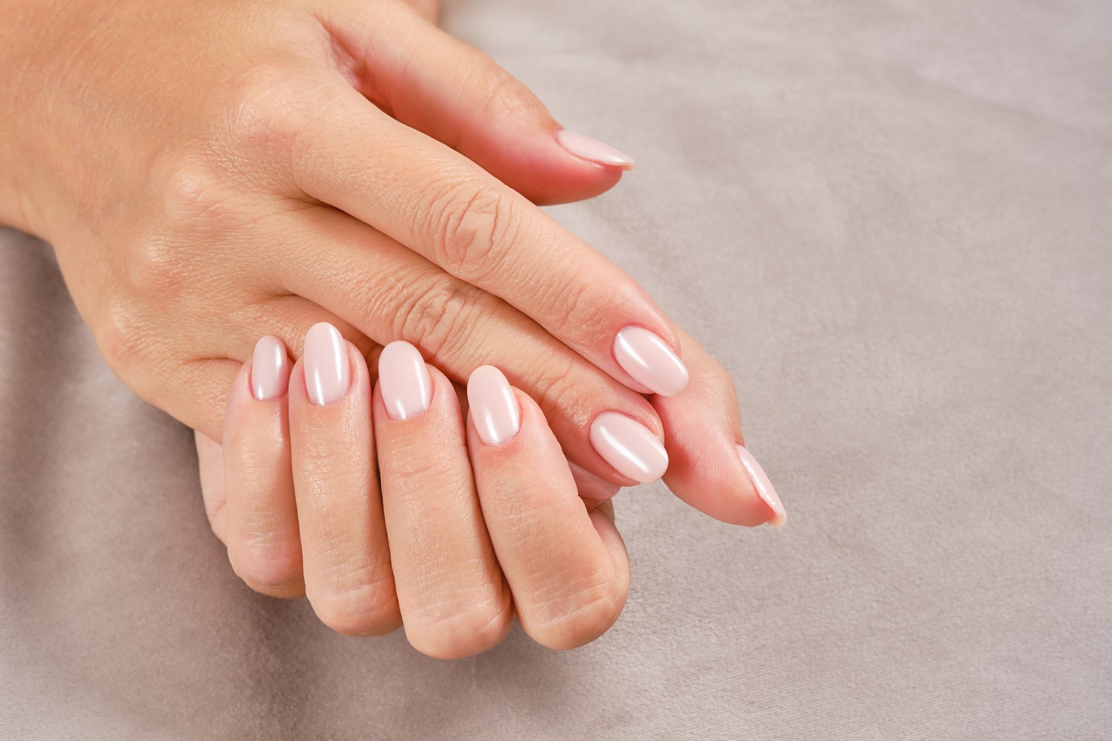 Care for sensuality female hands. New artificial fingernails of adult woman. Art painting of nails.  Shallow depth of field