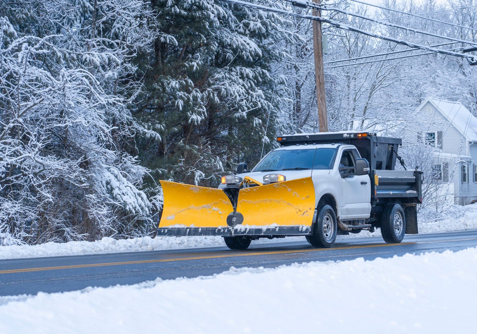 truck with snowplow installed in front