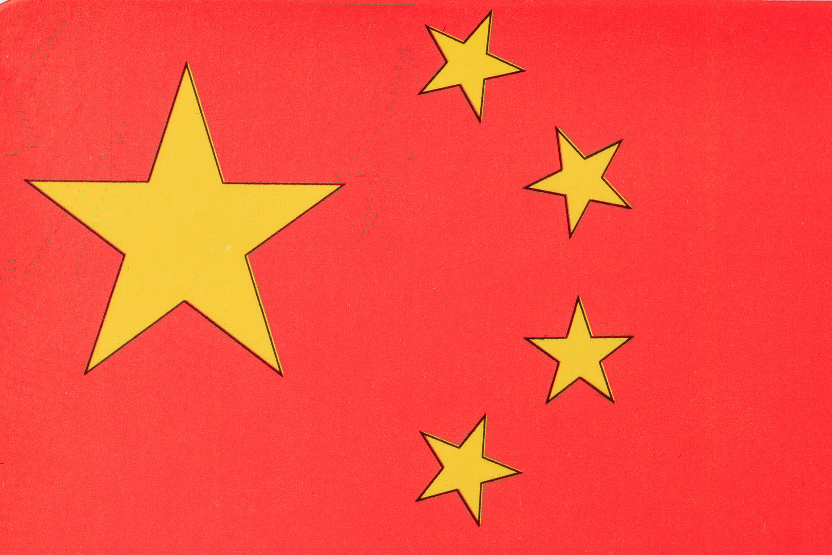 Chinese national flag with five yellow stars on red background.