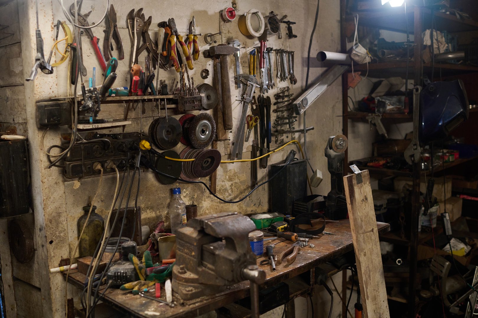 No people shot of workshop wall with hanging tools and mechanical equipment for maintenance work