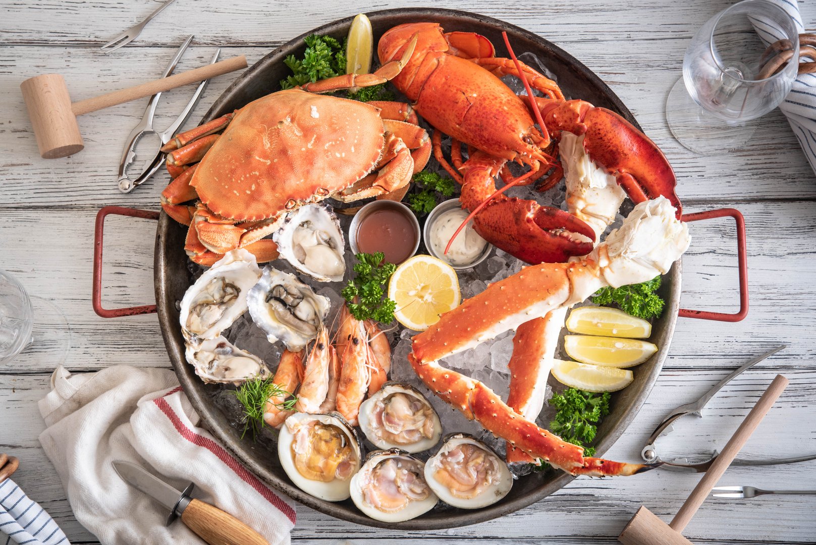 Seafood platter with steamed shrimp, seafood boil and blue crabs