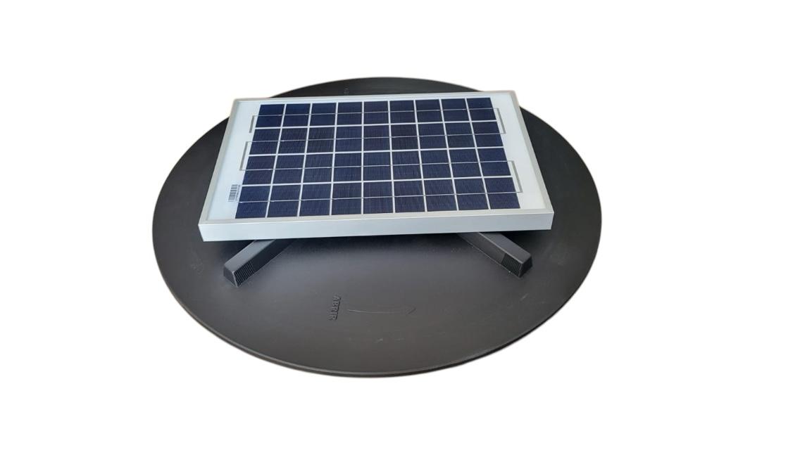 A small solar panel mounted on a circular black base, isolated on a white background.