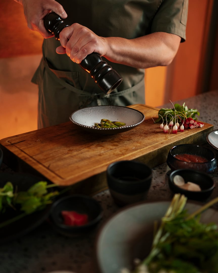 Male chef preparing salad in restaurant kitchen