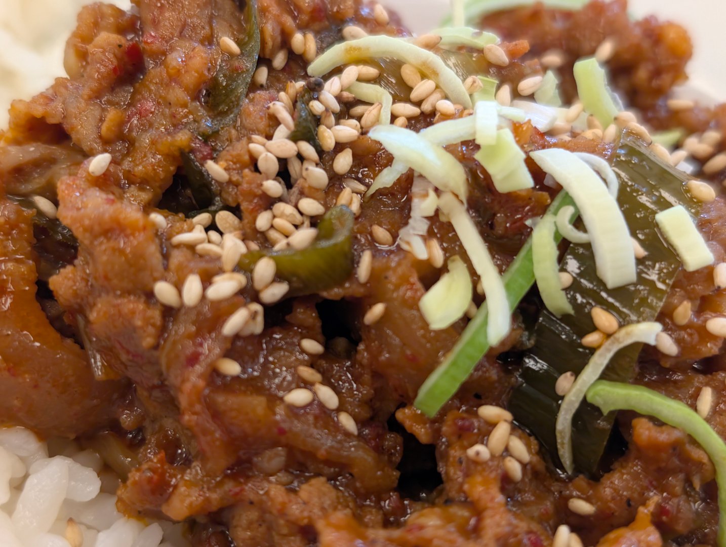 Close up of a Korean pork bulgogi dish on white rice.