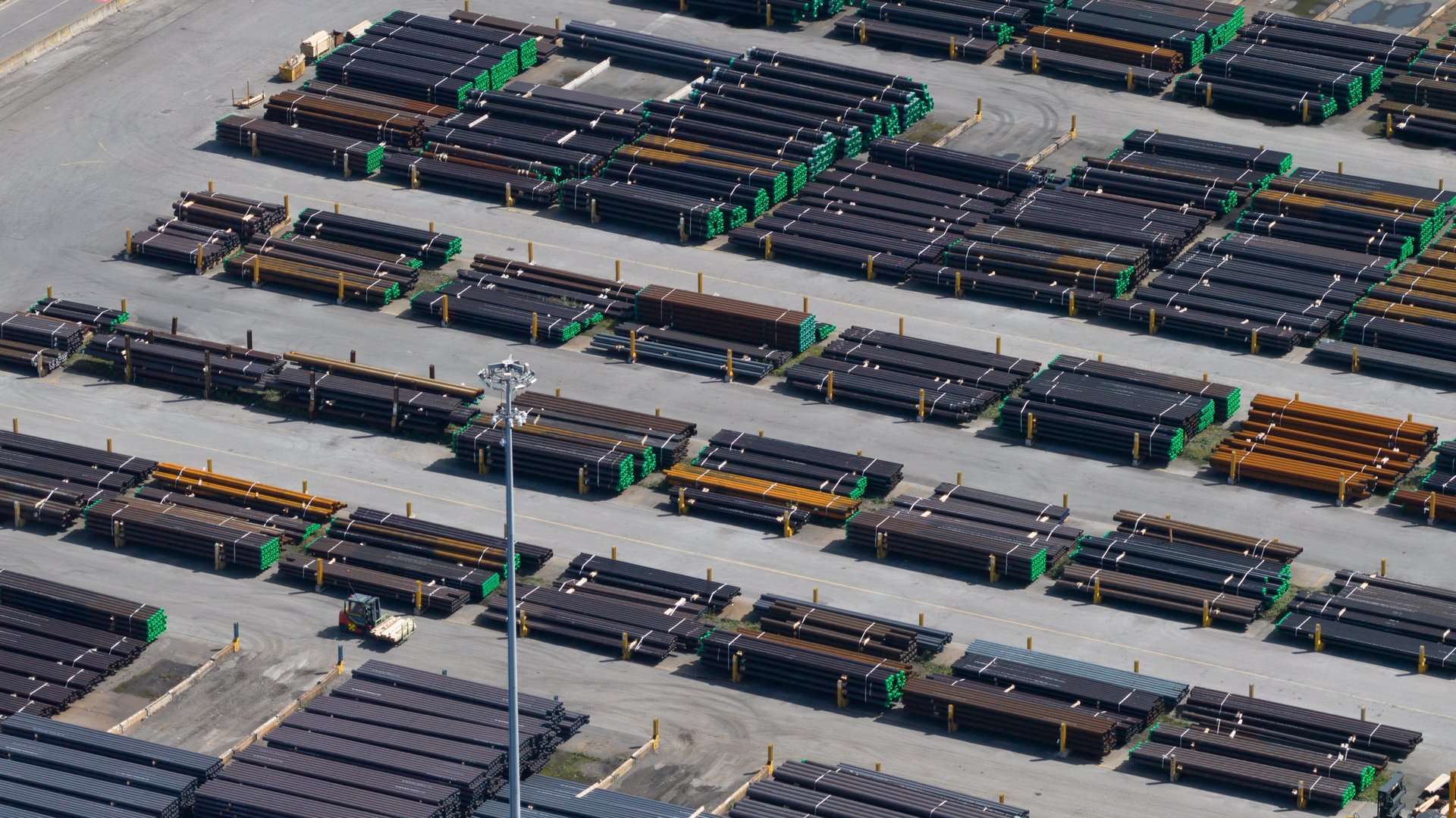 Large factory for pipes and tubing, connections, from steel in Dalmine, Italy. Aerial drone video.