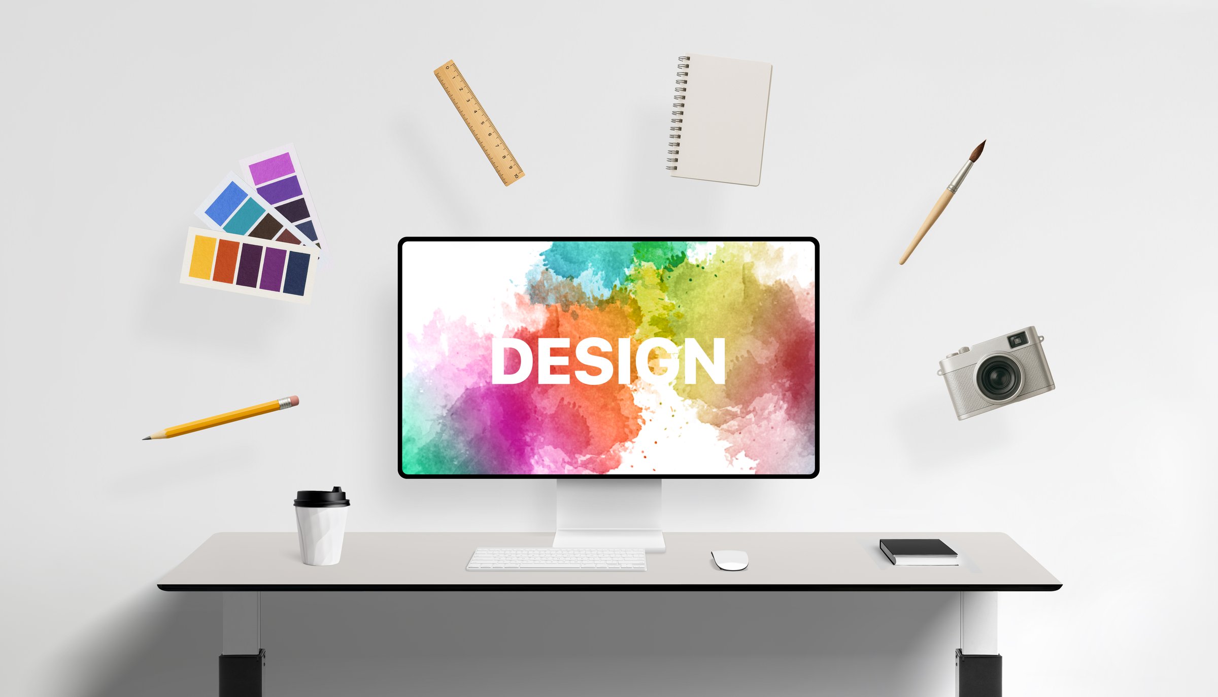 Design screen surrounded by floating creative tools like pencil, color palette, ruler, notebook, paintbrush, and camera