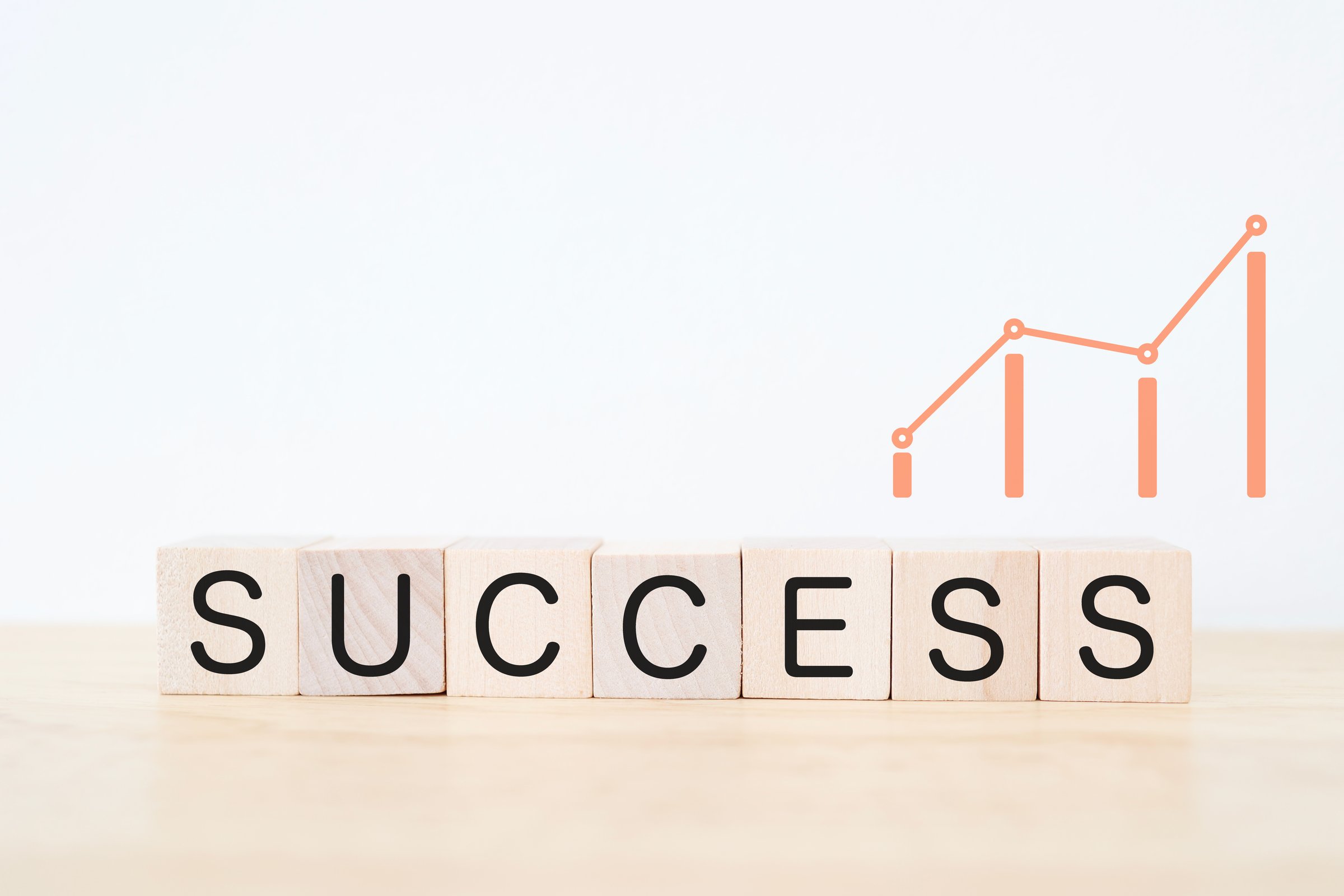 SUCCESS and rising graph. Business image on white background symbolizing success and growth.