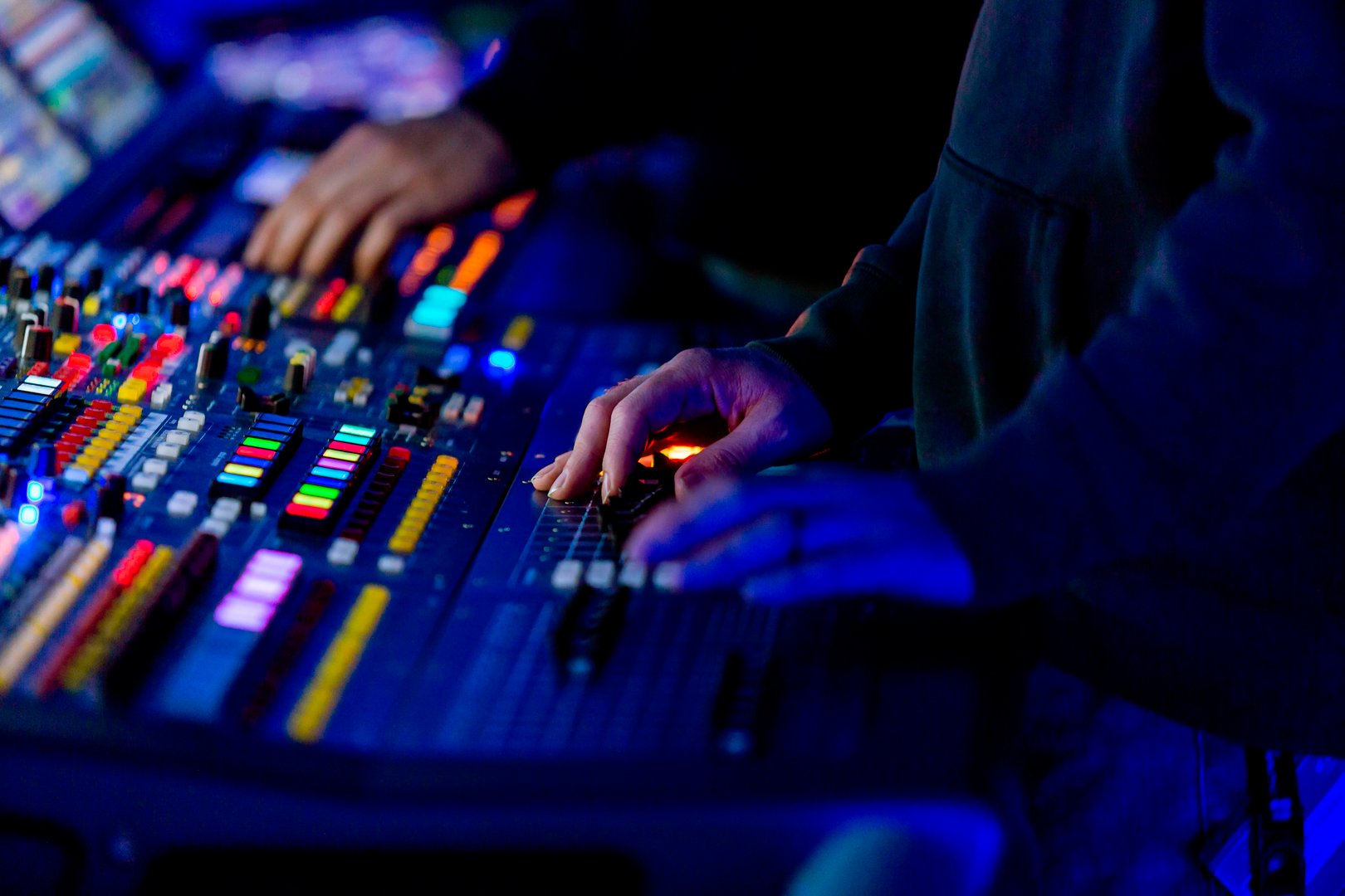 Sound engineer mixing live at night