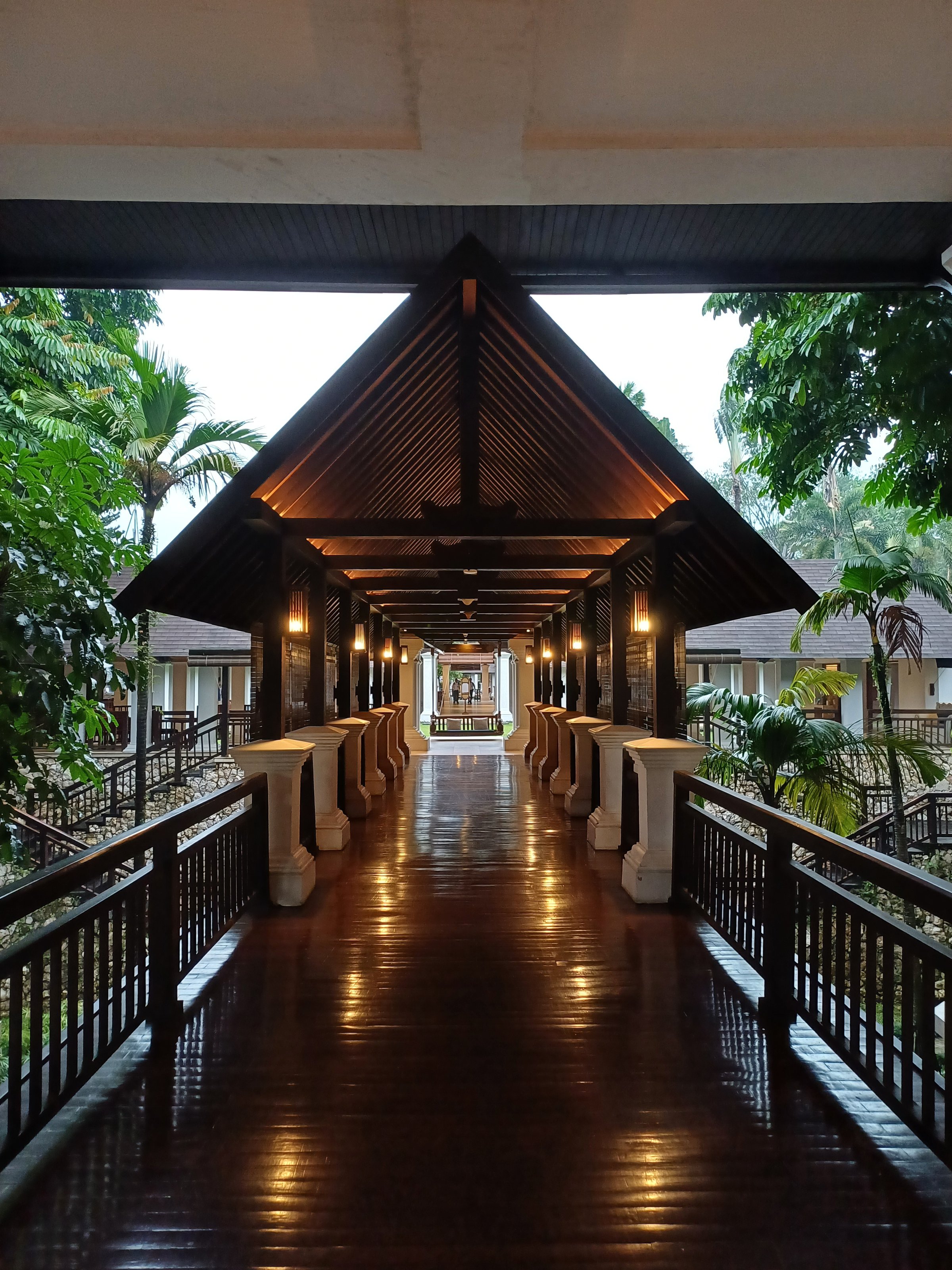 Classic style a wooden alley with classic lamp decoration. The light reflected on the wooden floor.