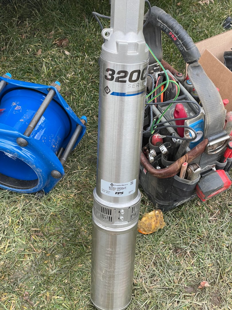 Professional well pump technician performing replacement service in Dutchess County, NY