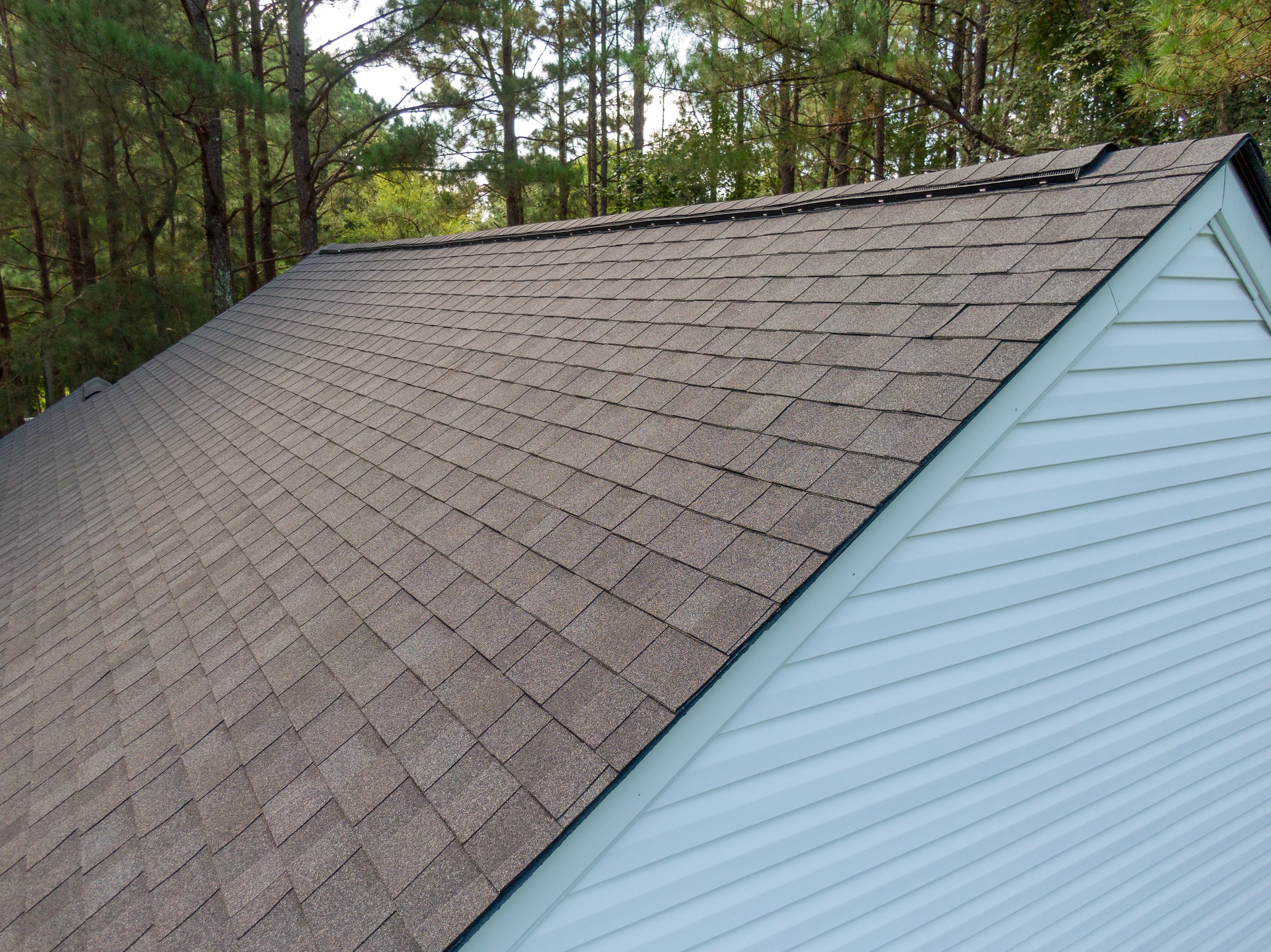 Newly installed architectural asphalt shingle roof on a residential structure