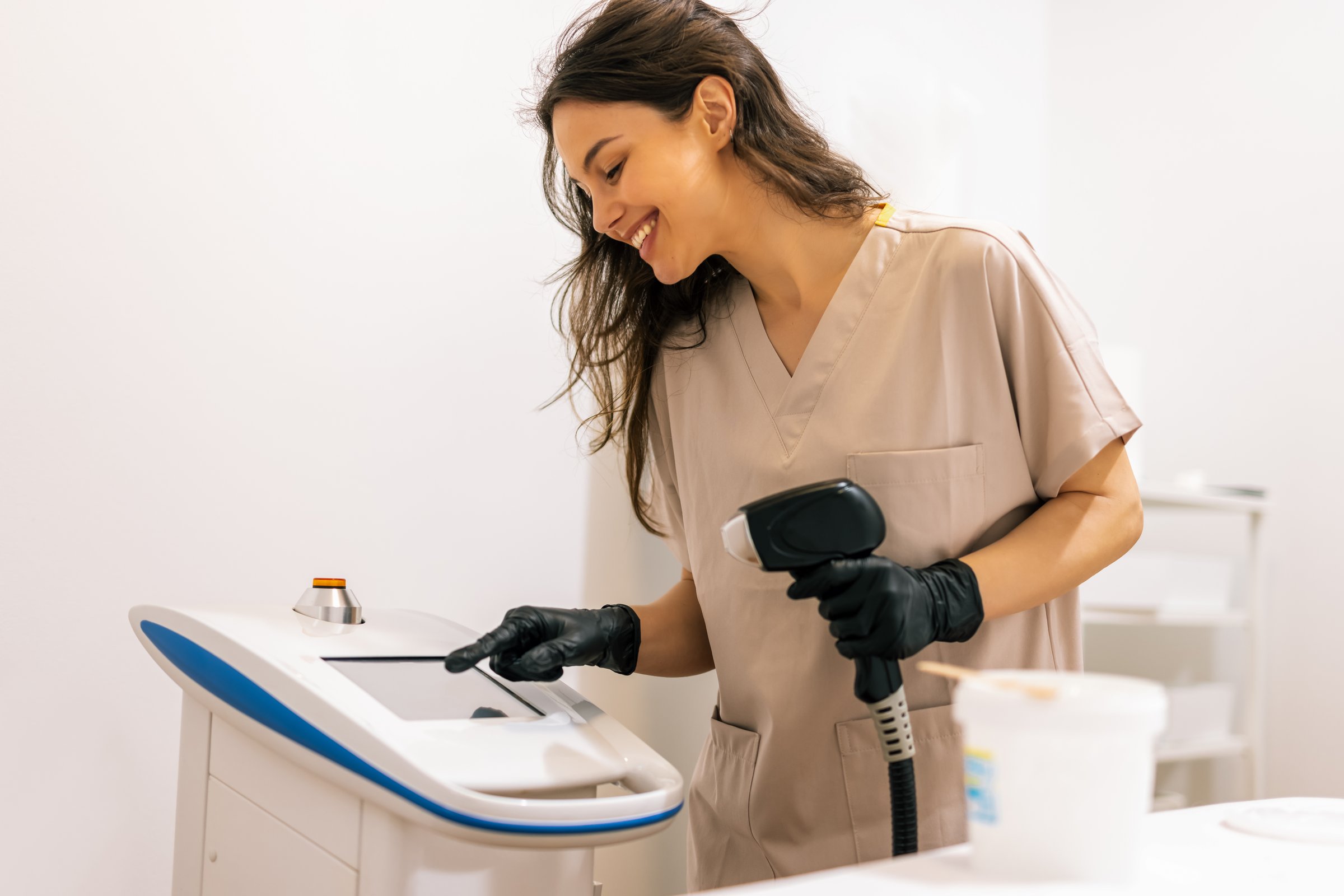 Laser epilation and cosmetology in beauty salon. Hair removal procedure.